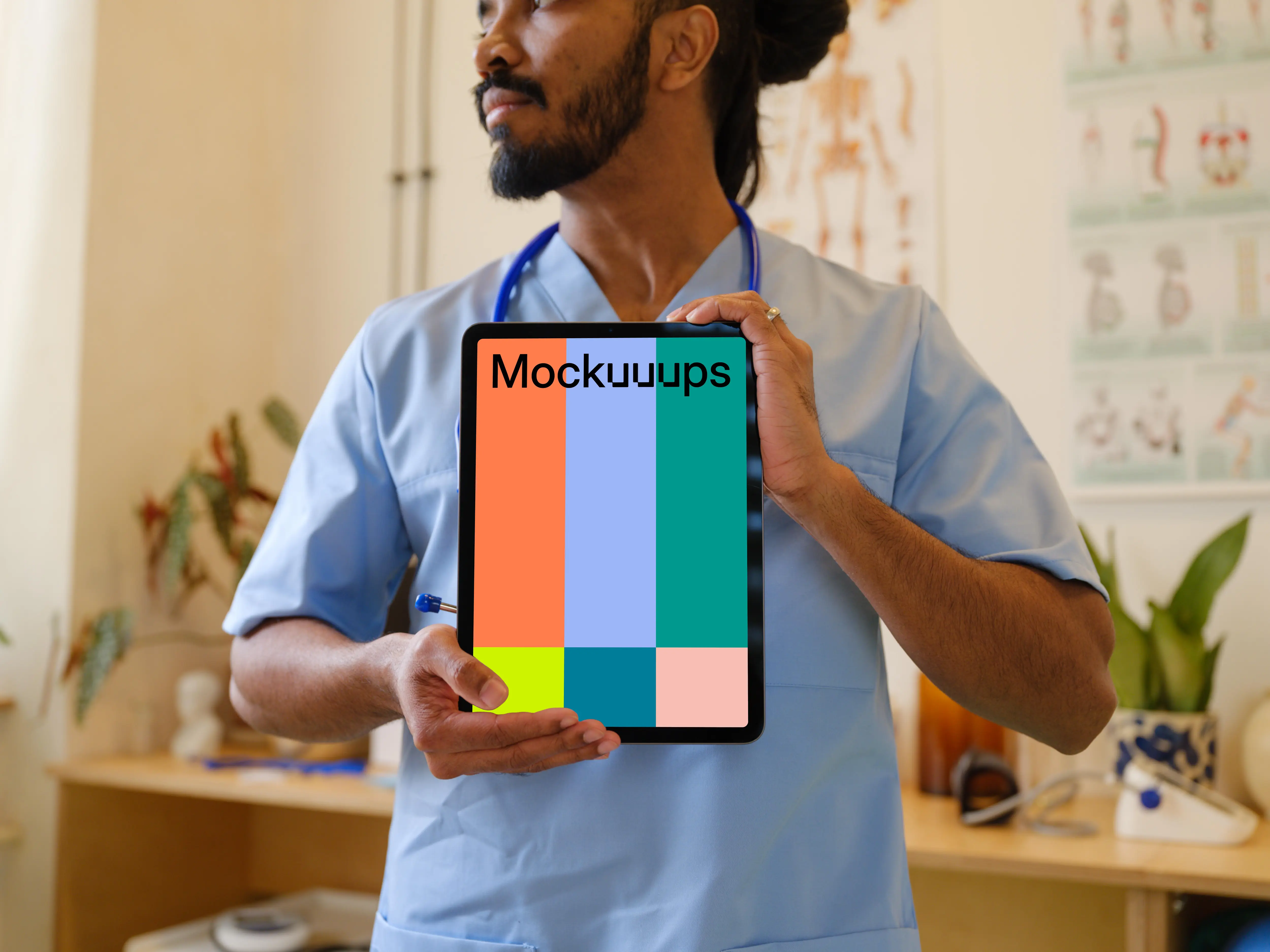 Male doctor holding an iPad mockup