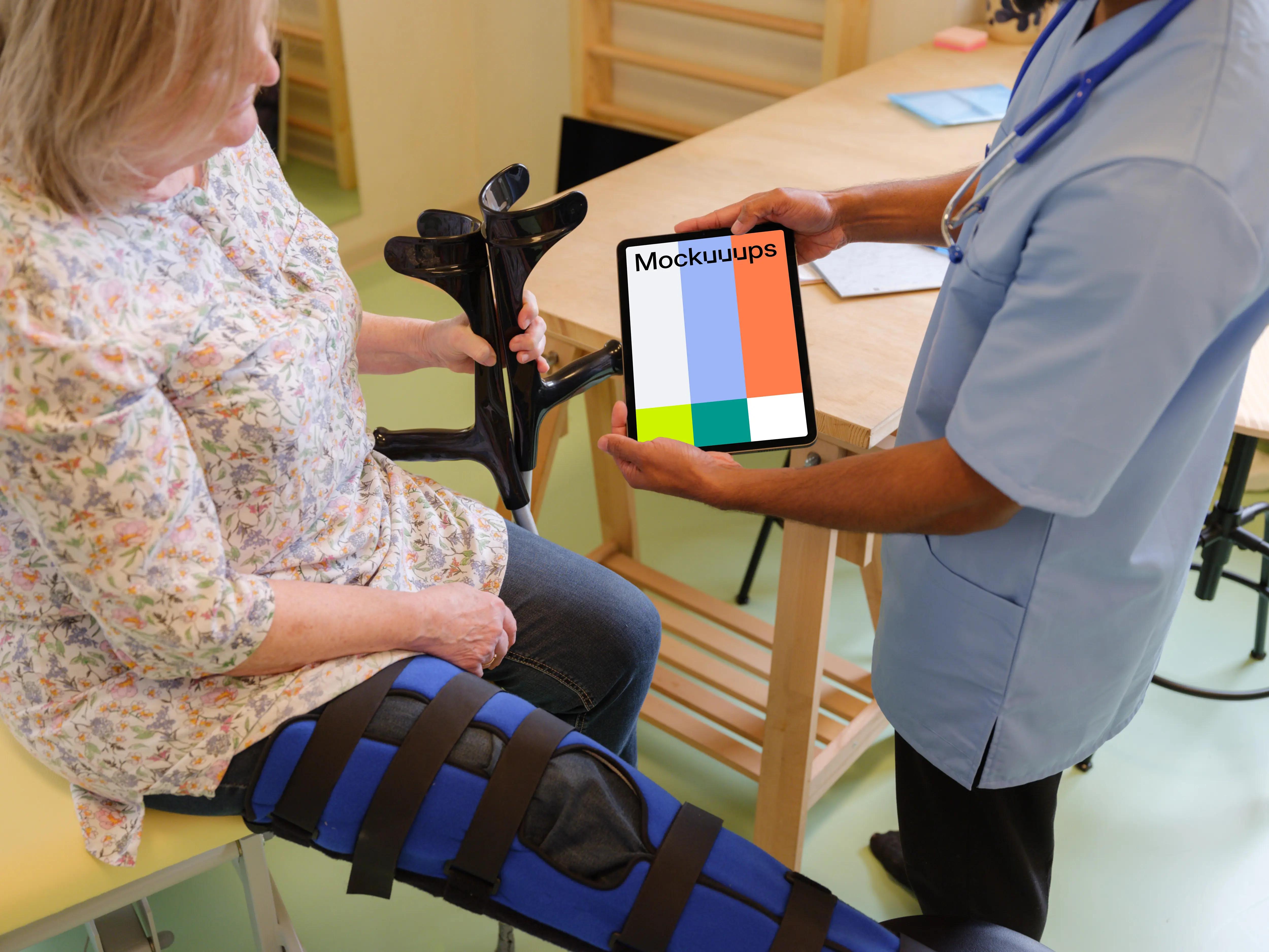 Male doctor holding an iPad mockup