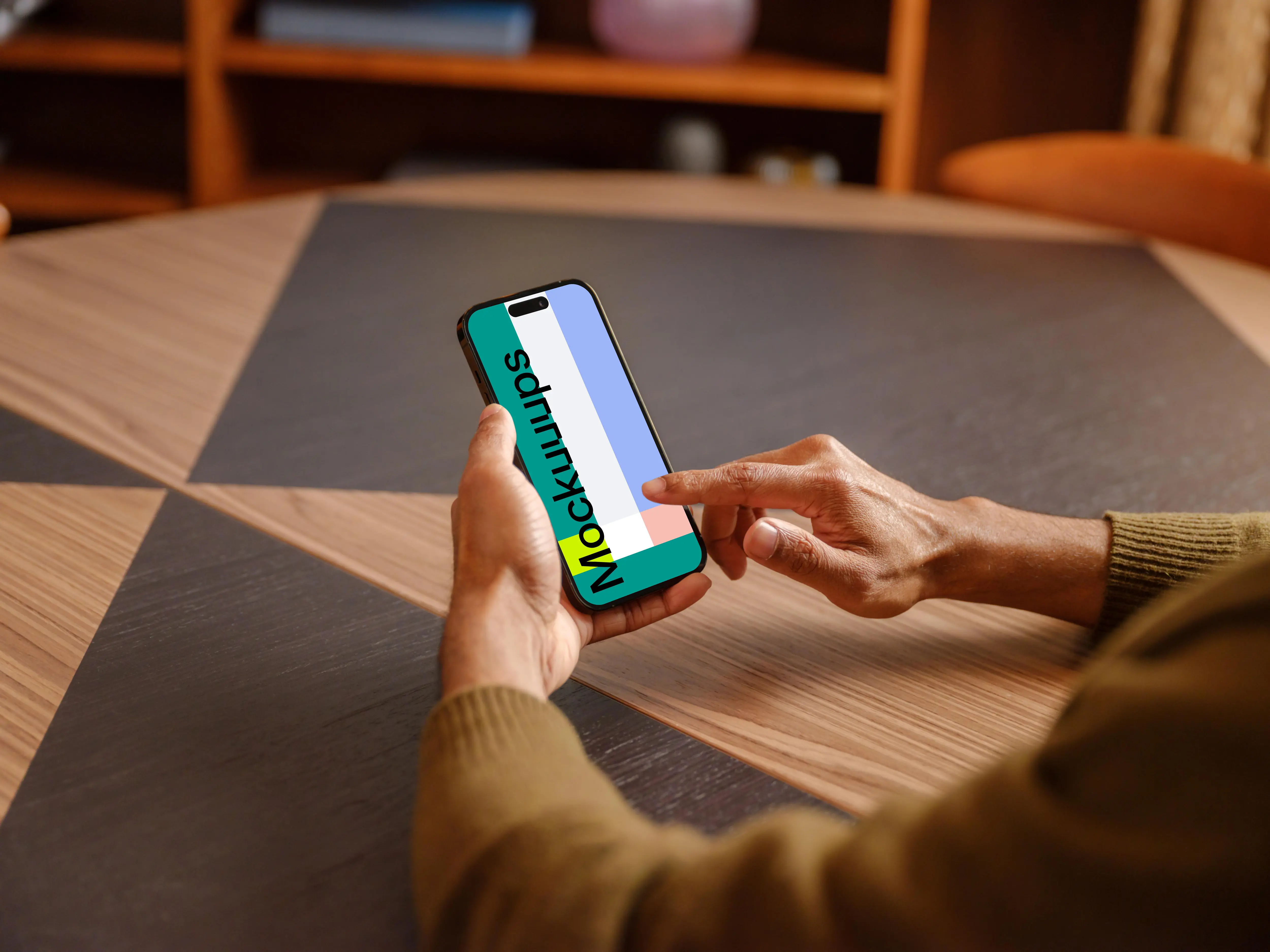 Male hand scrolling on the iPhone mockup