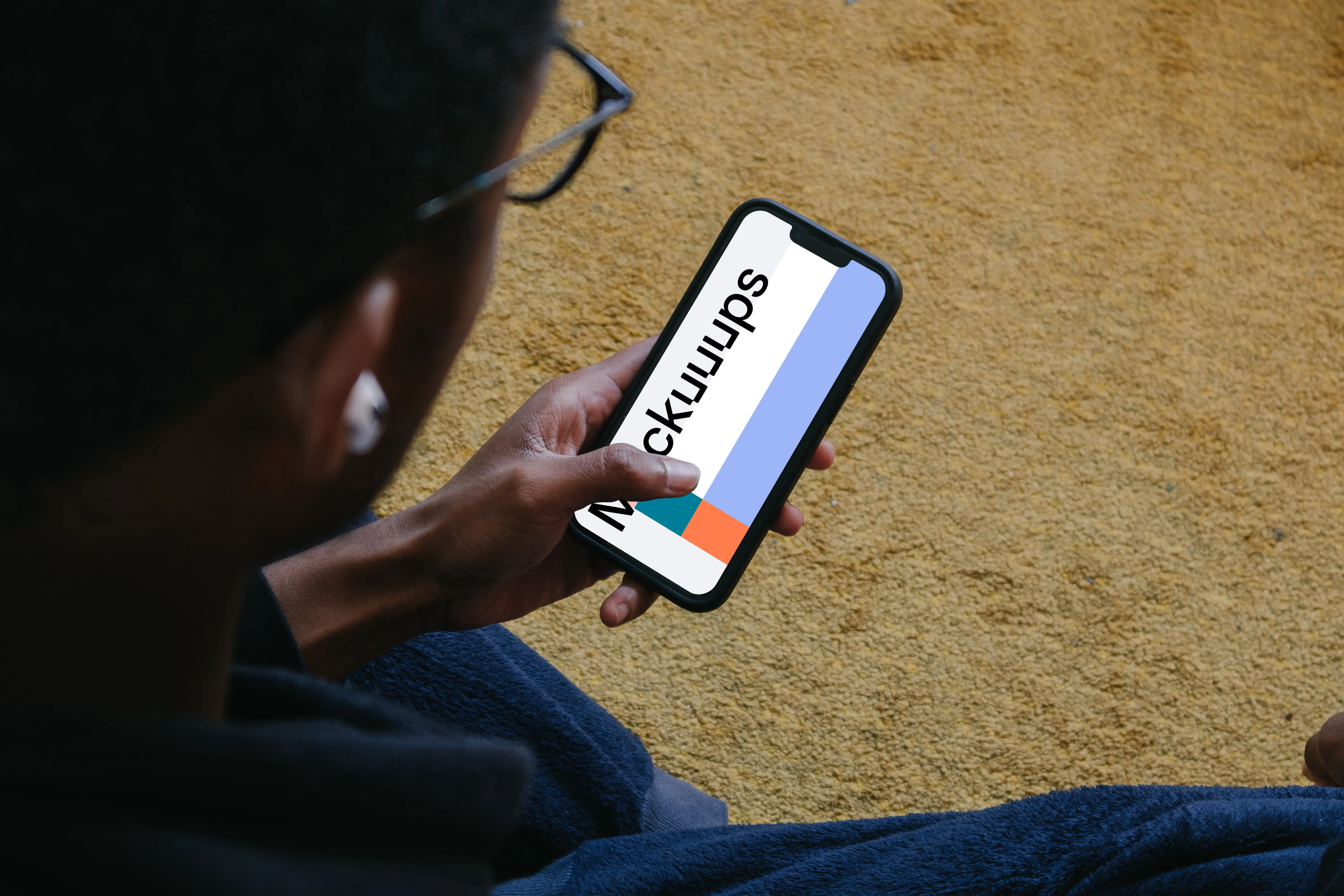 Male hand typing on iPhone mockup