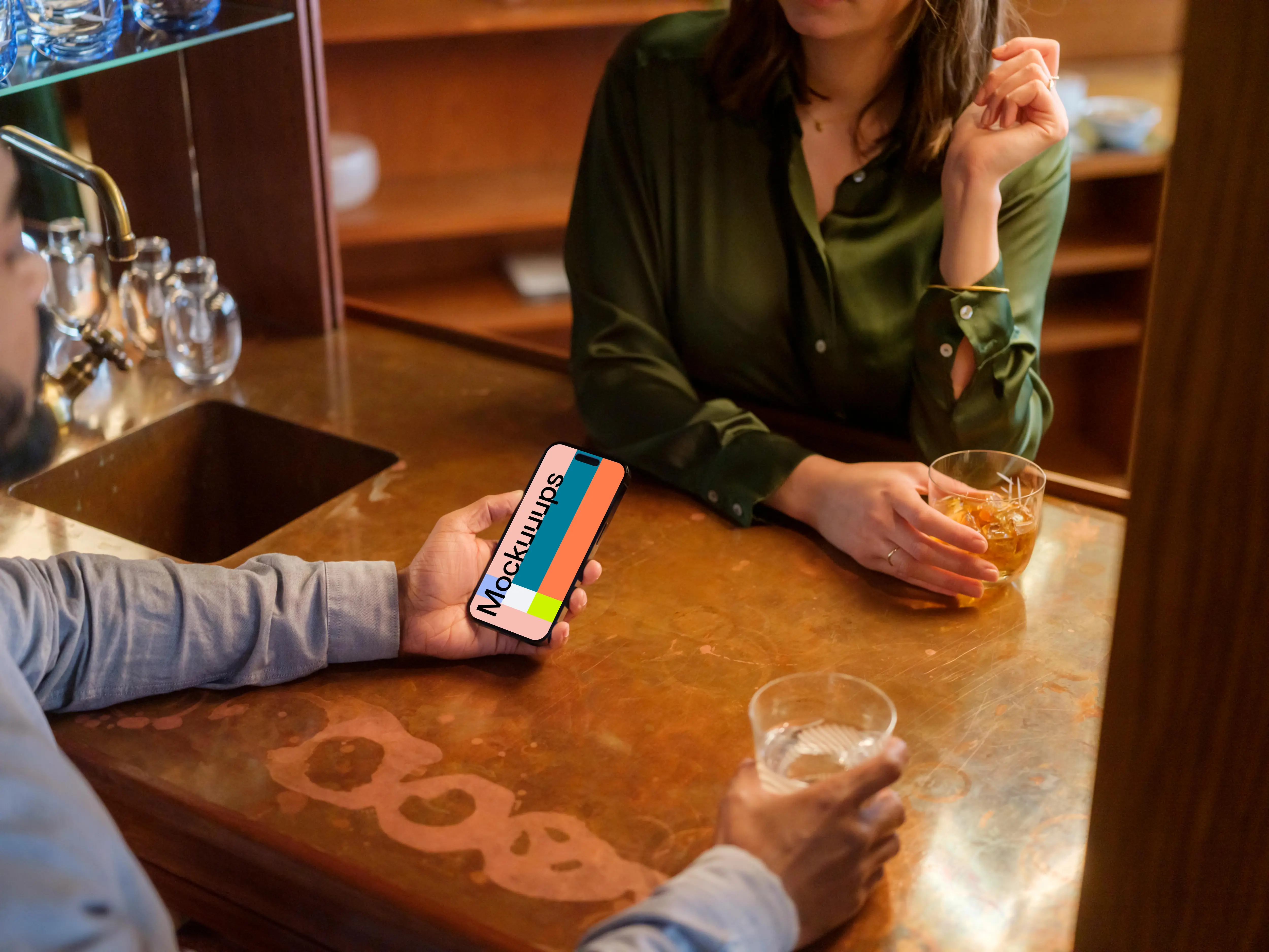 Man holding a iPhone mockup in the lounge