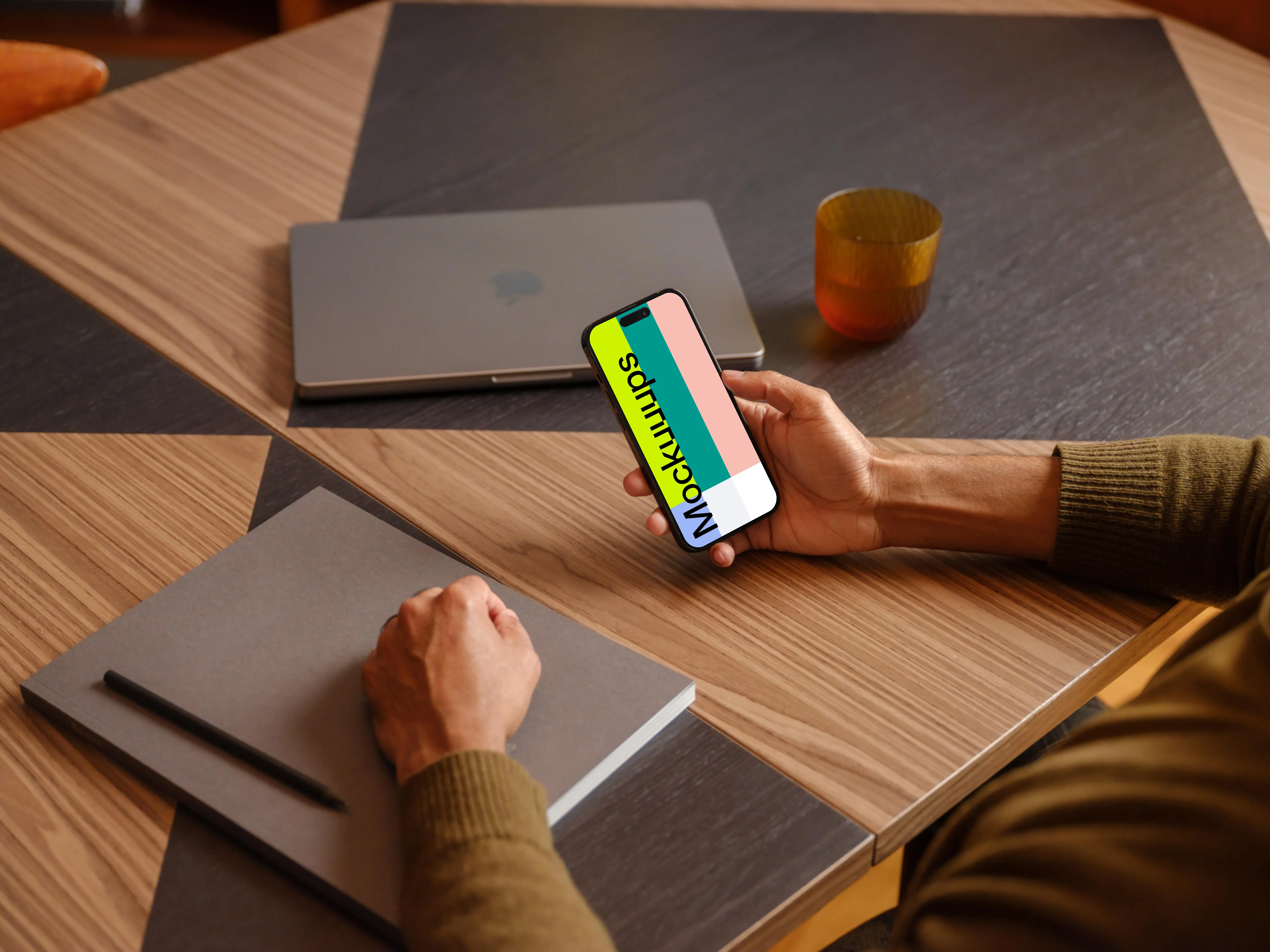 Man holding a iPhone mockup in the office environment
