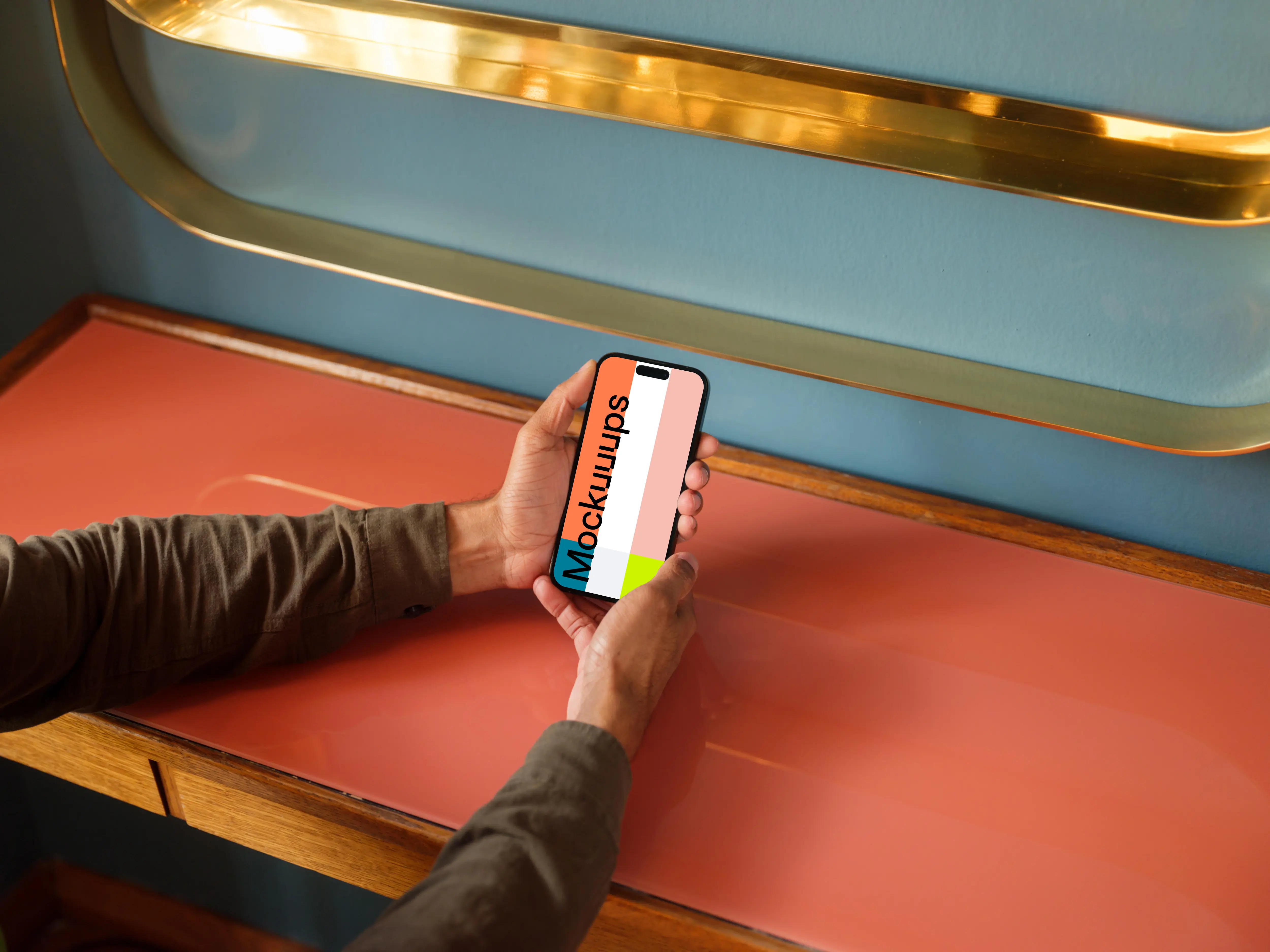 Man holding a phone in the lounge