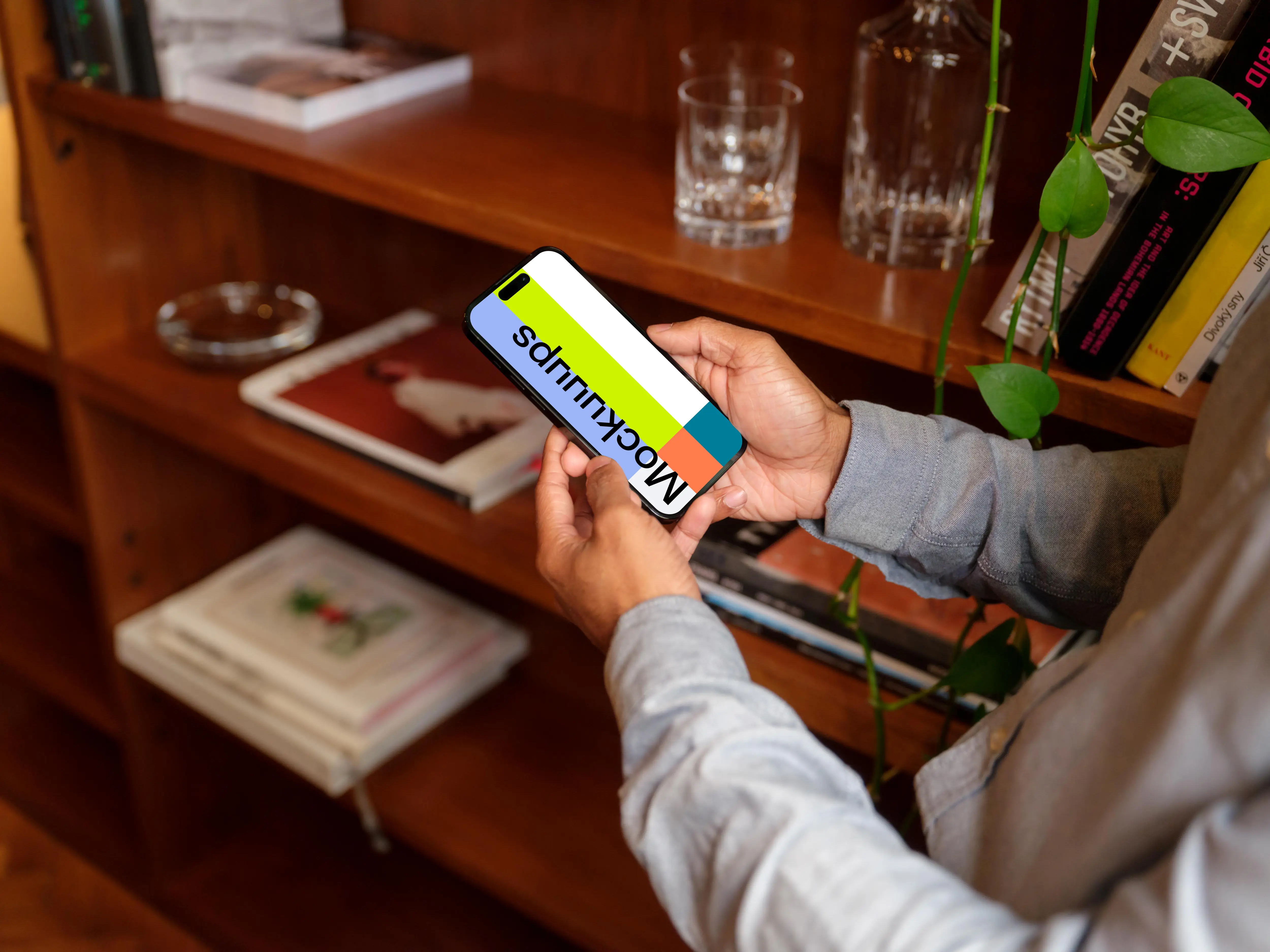 Man holding a phone mockup in the office