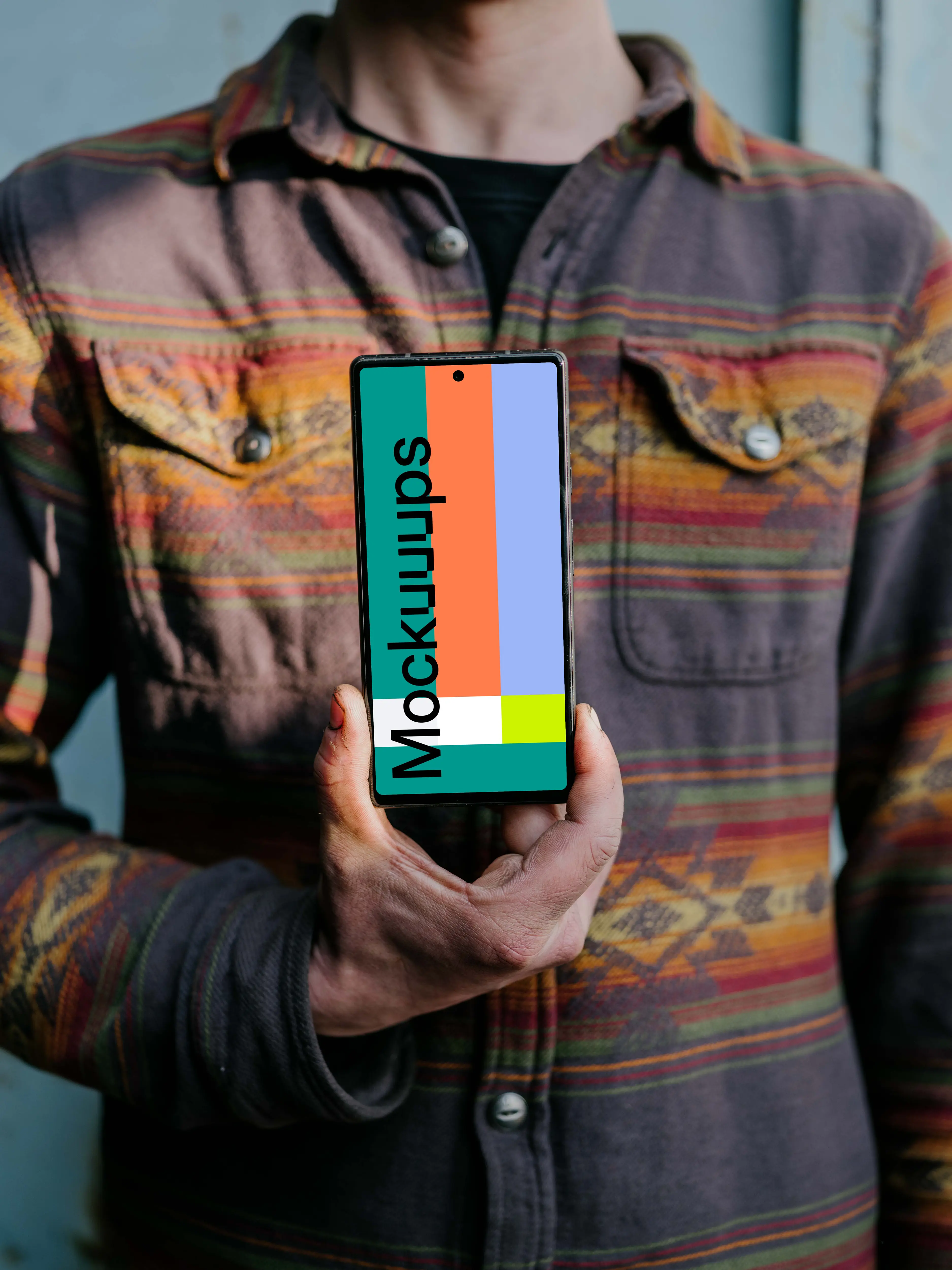 Man holding up a Pixel 6 mockup
