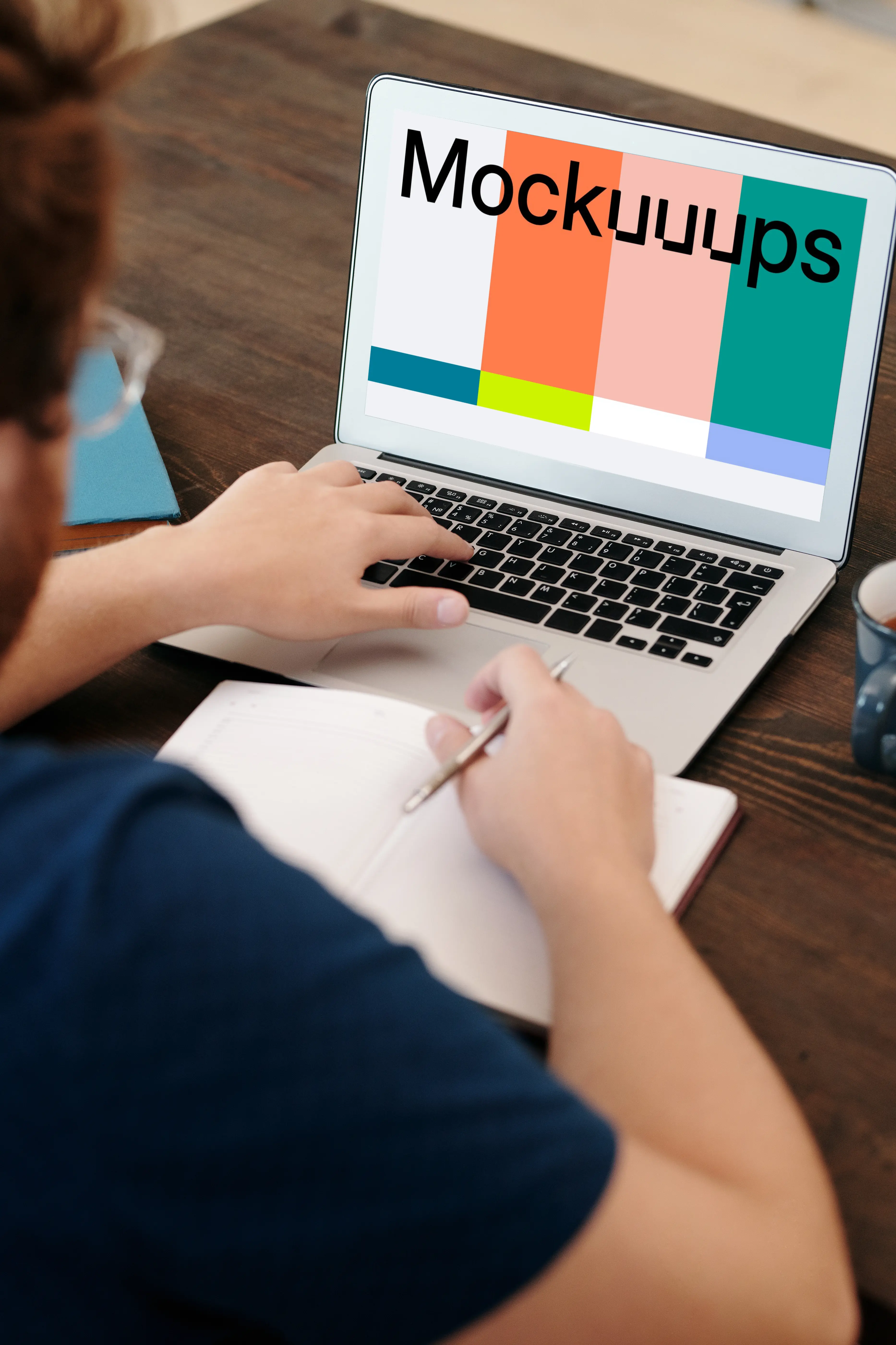 Man in glasses using a MacBook Air mockup
