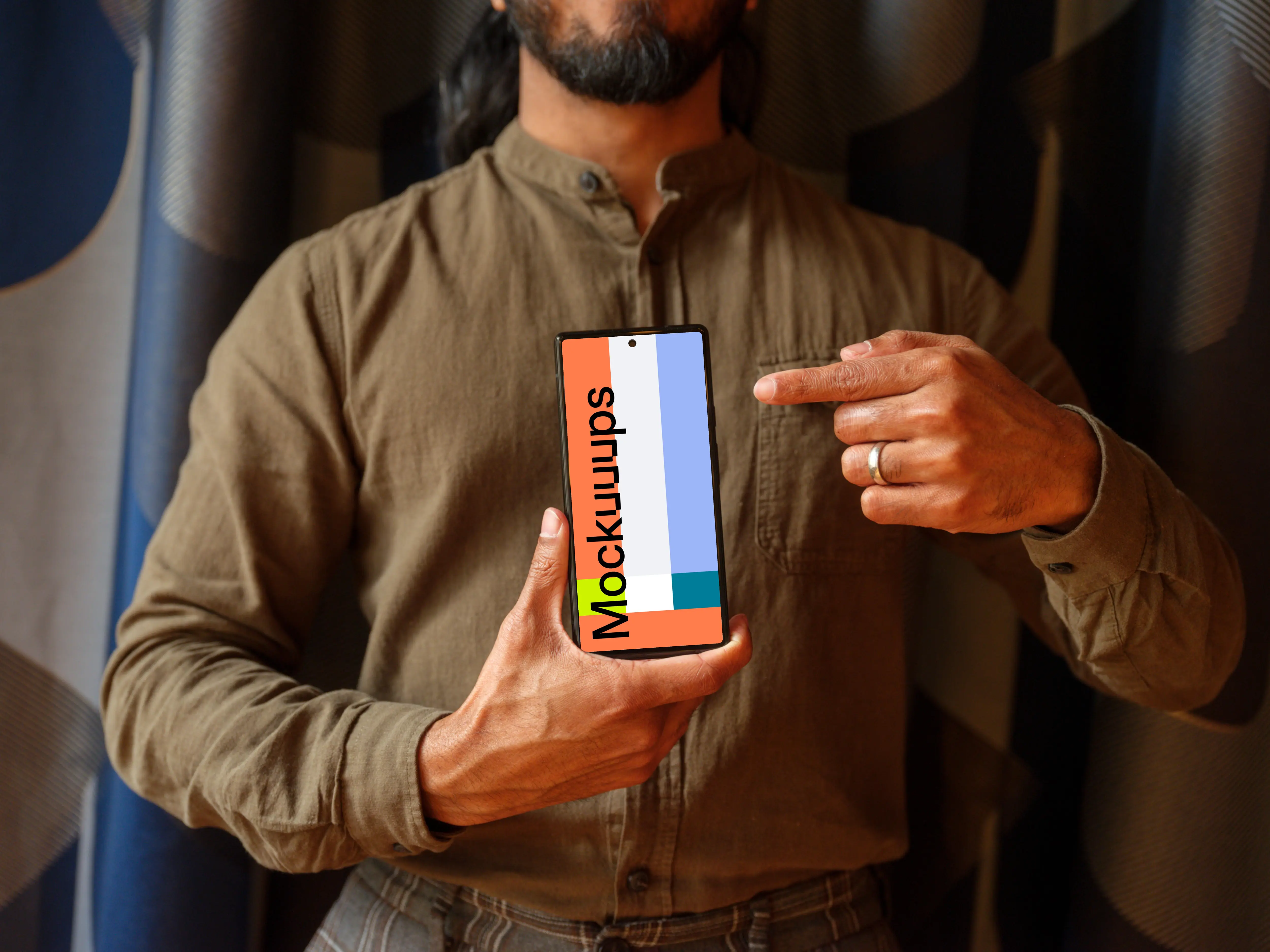 Man in khaki shirt holding a Google Pixel 6 mockup