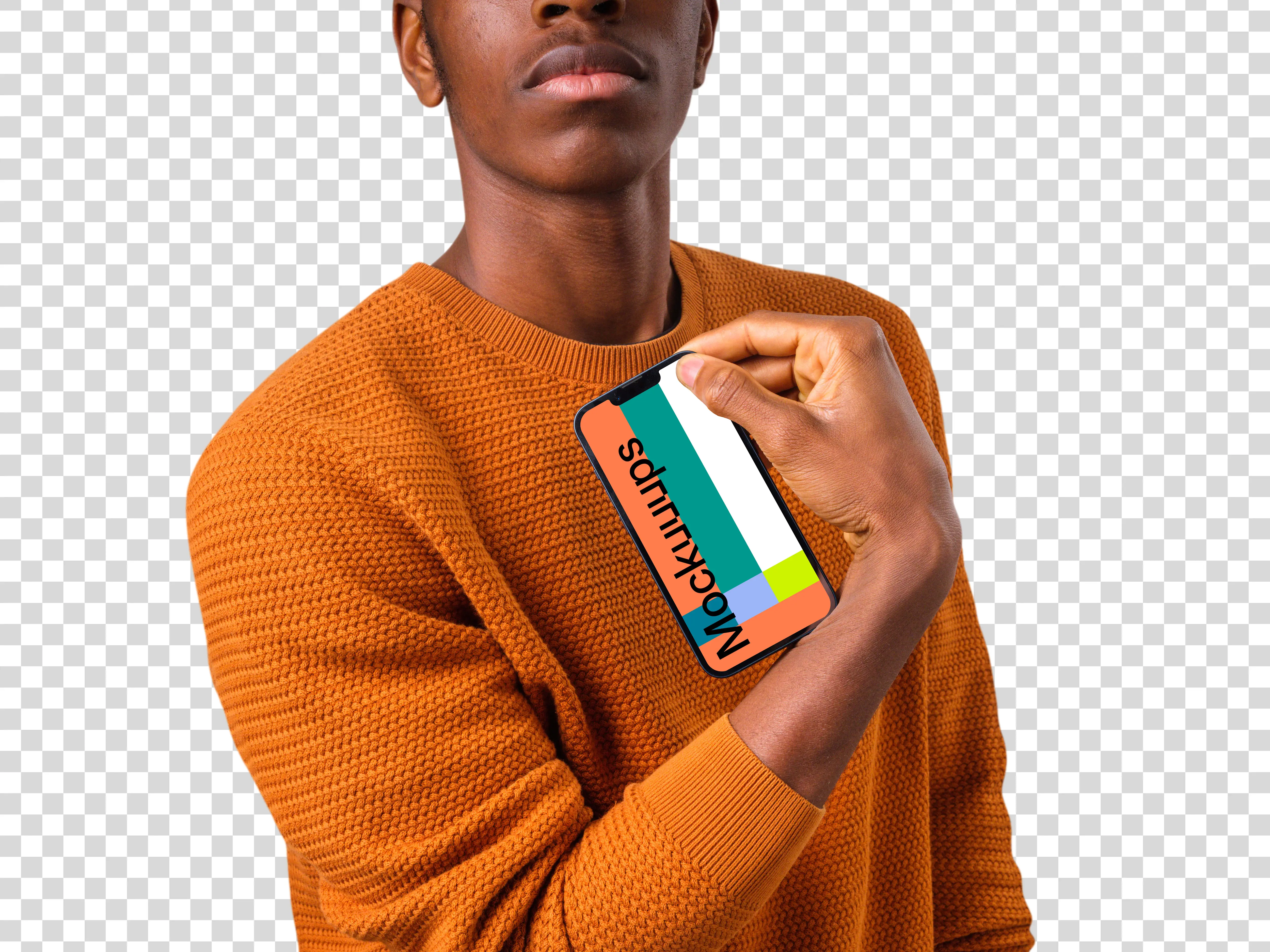 Man in orange sweater holding iPhone mockup in one hand