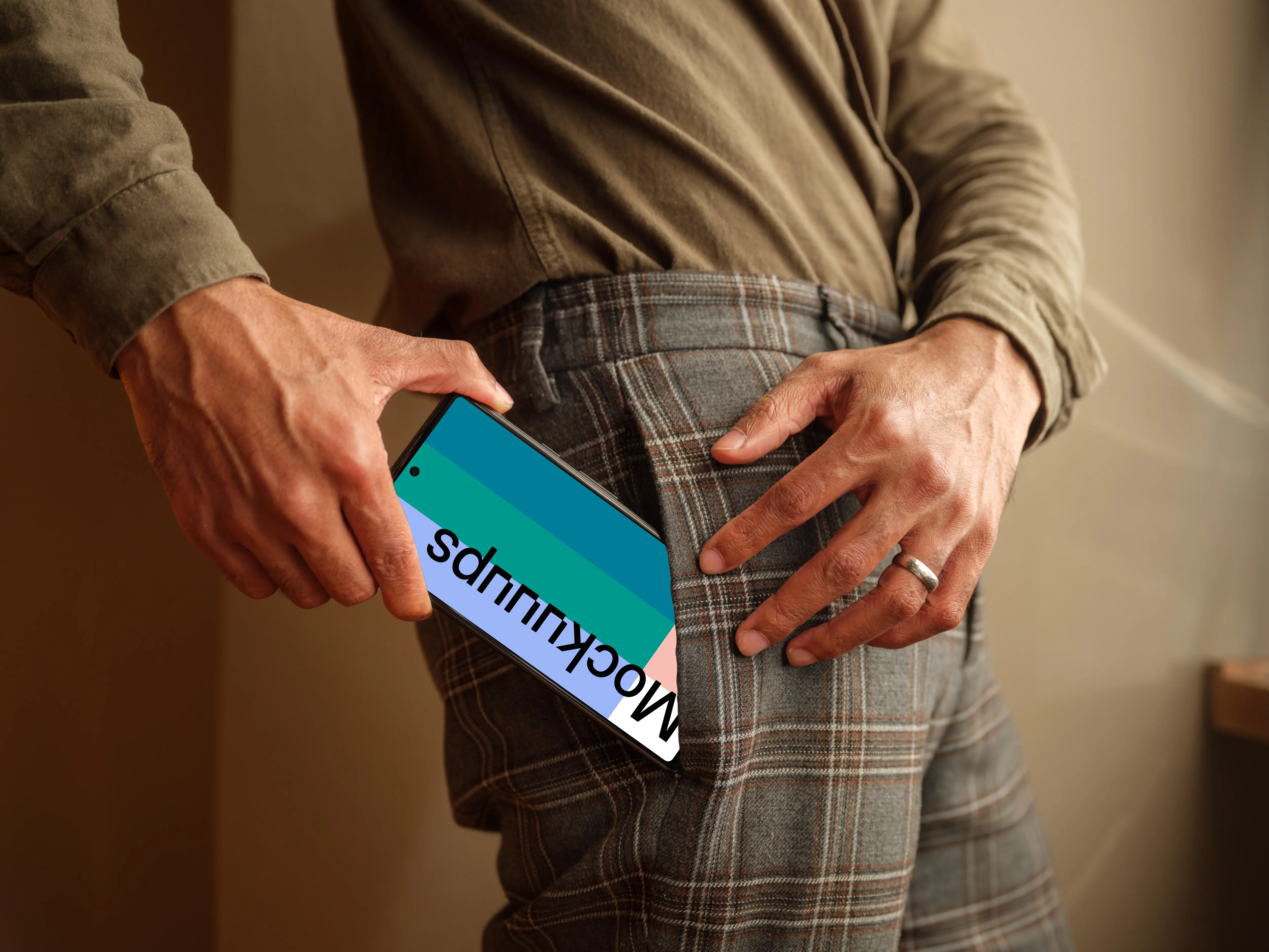 Man taking a phone mockup out of his pocket