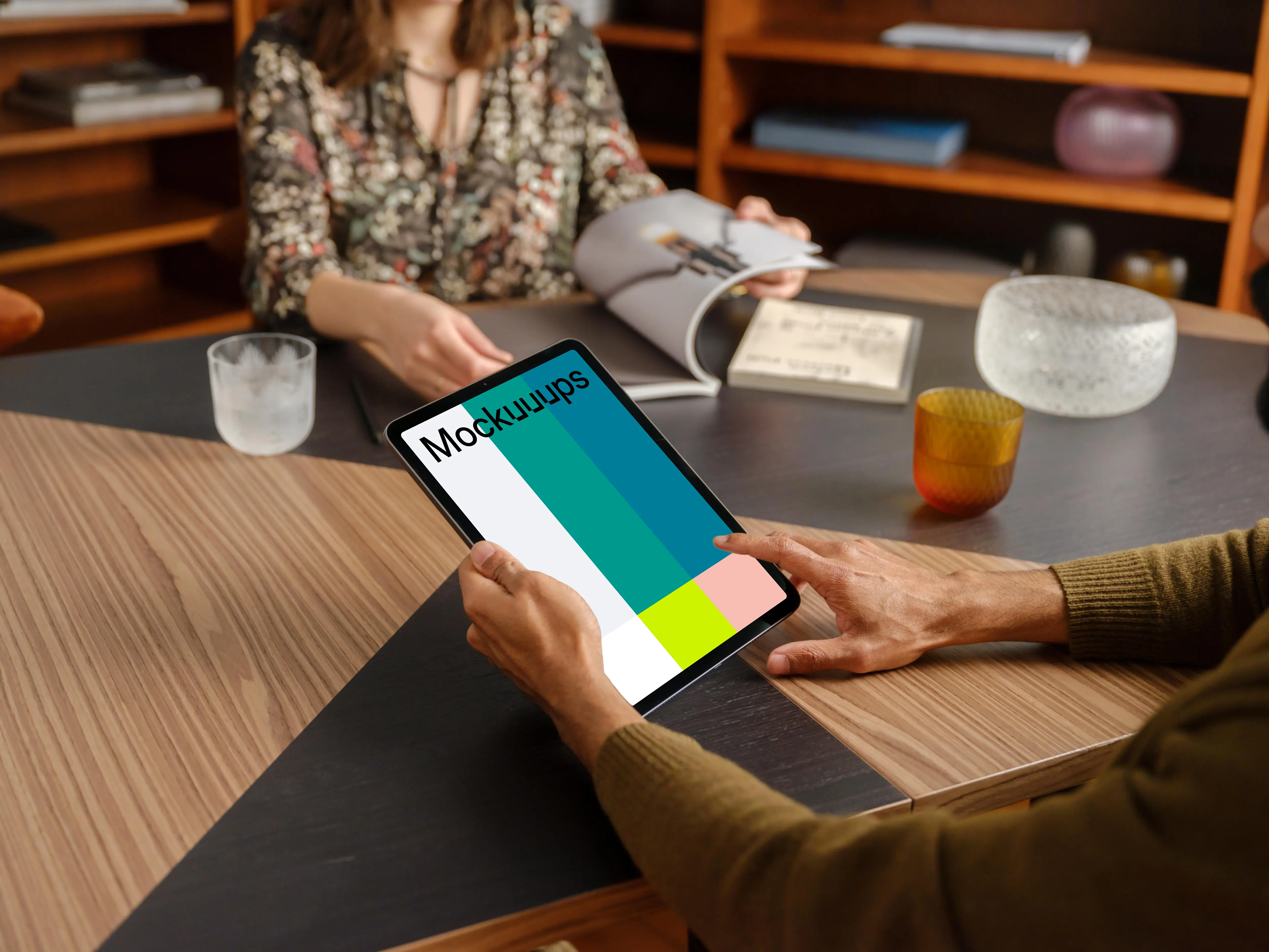 Man working on tablet mockup in the lounge
