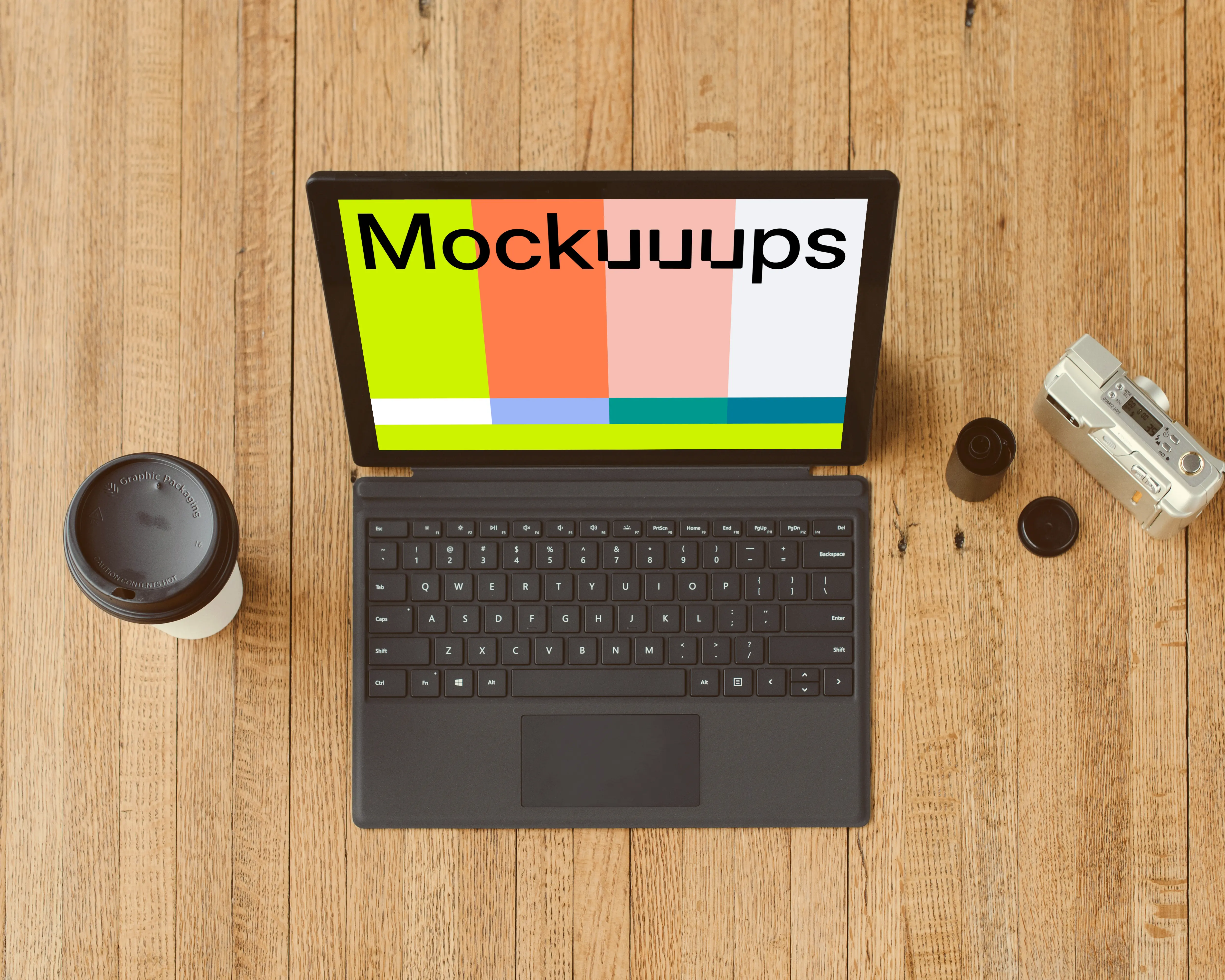 Microsoft Surface Laptop mockup beside a cup of coffee