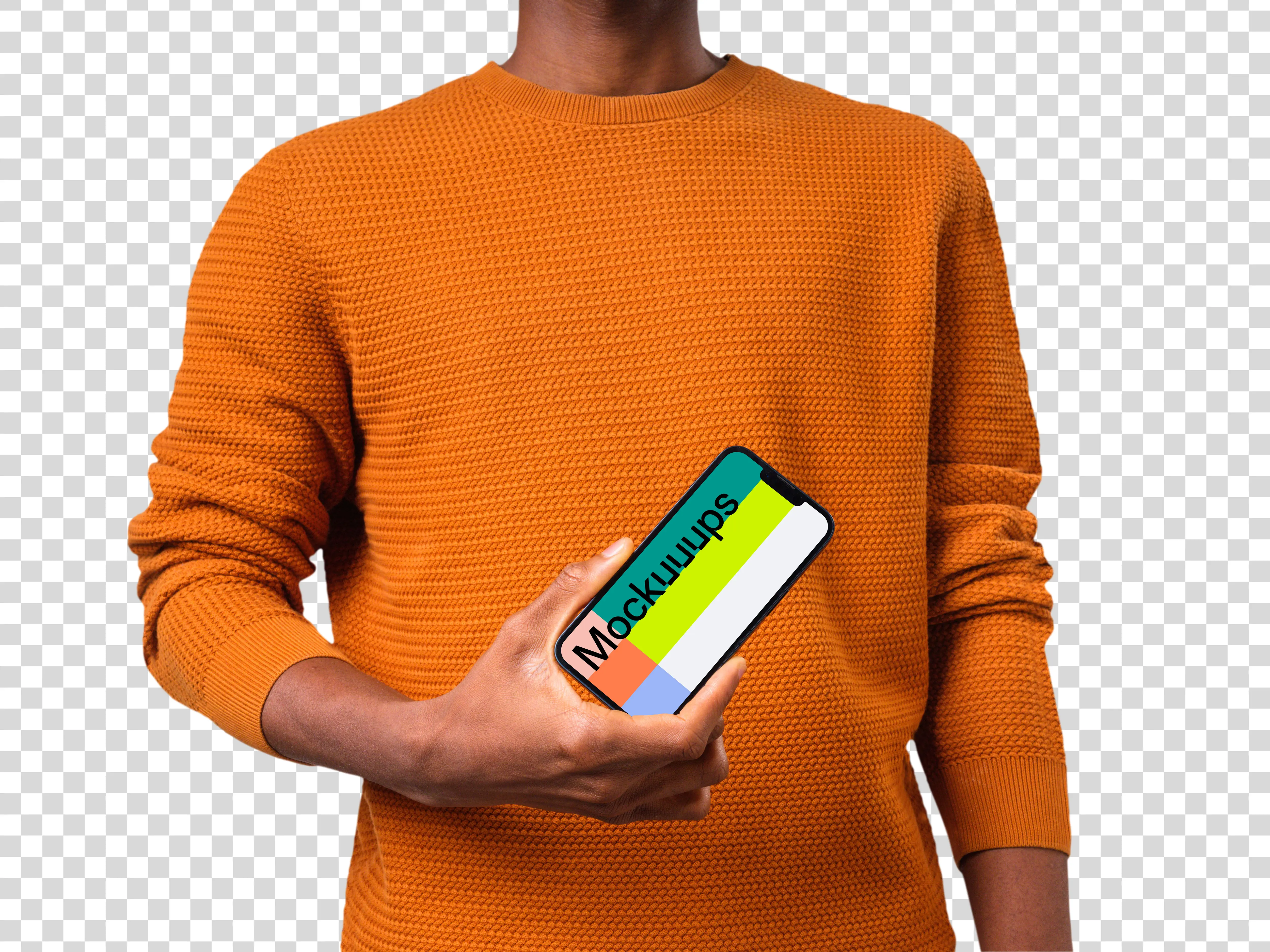 Mockup of a rotated iPhone mockup held by man in orange sweater