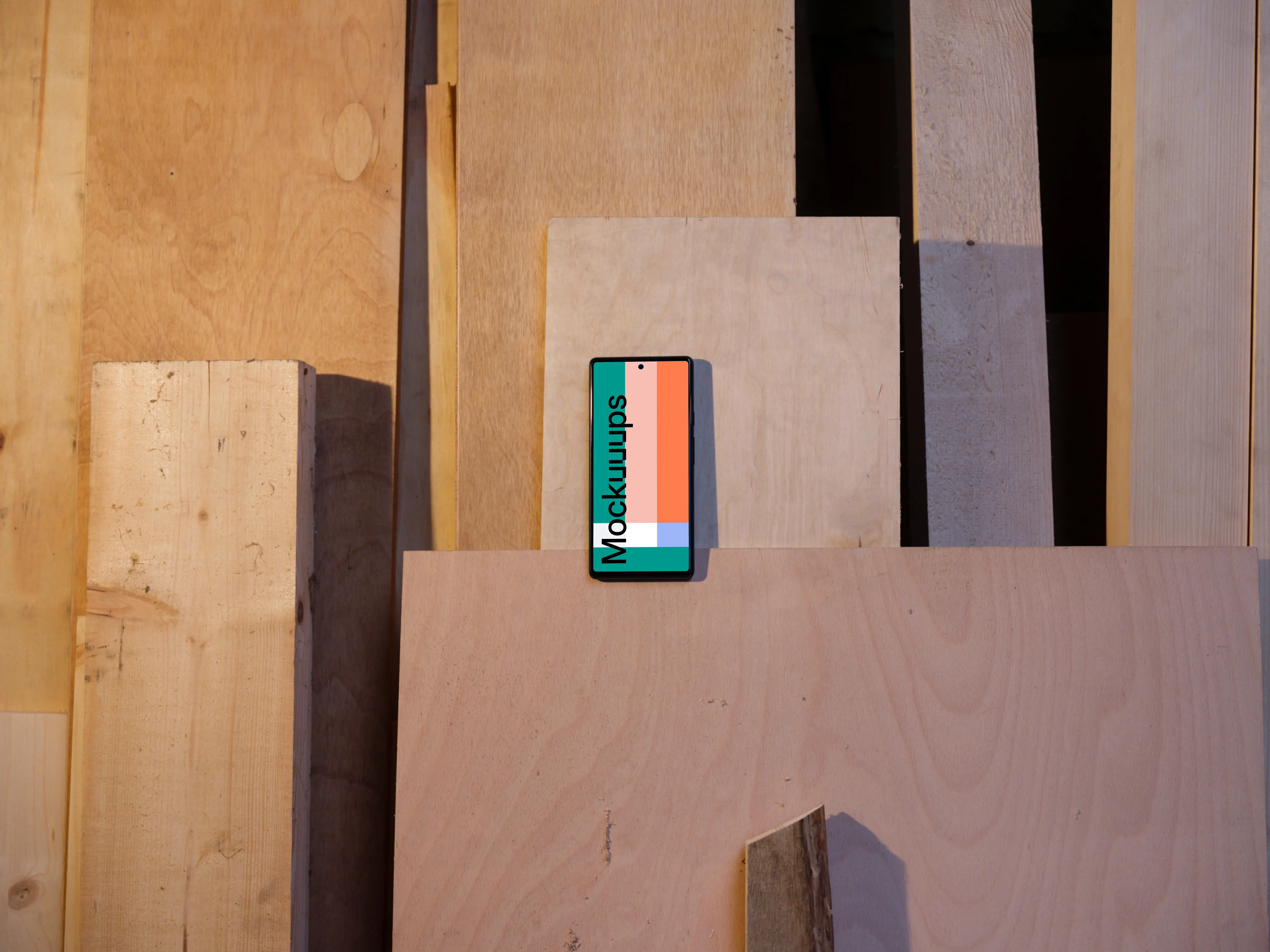 Mockup of Google Pixel 6 placed on wooden boards