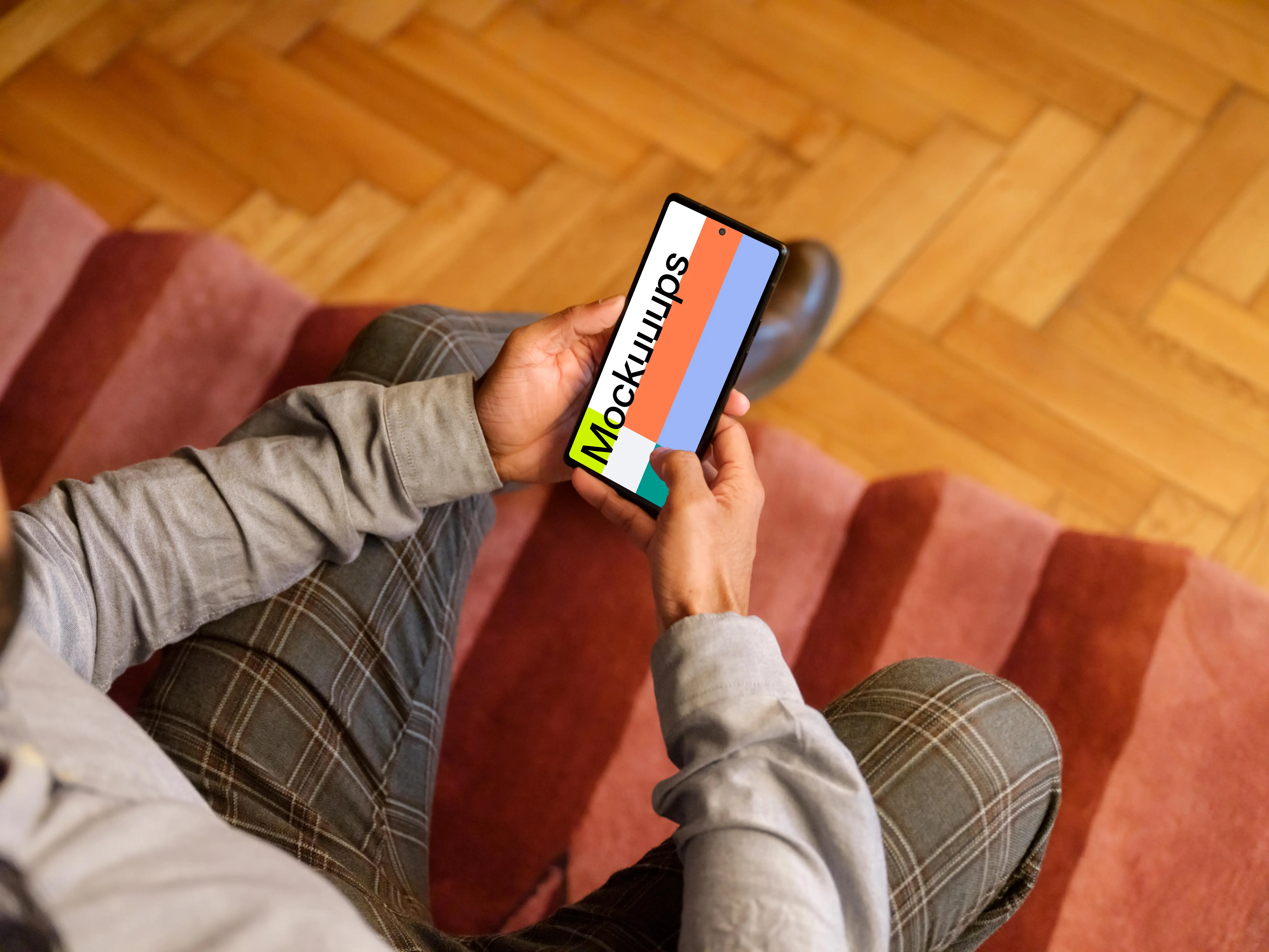 Office setting and man holding a Google Pixel mockup