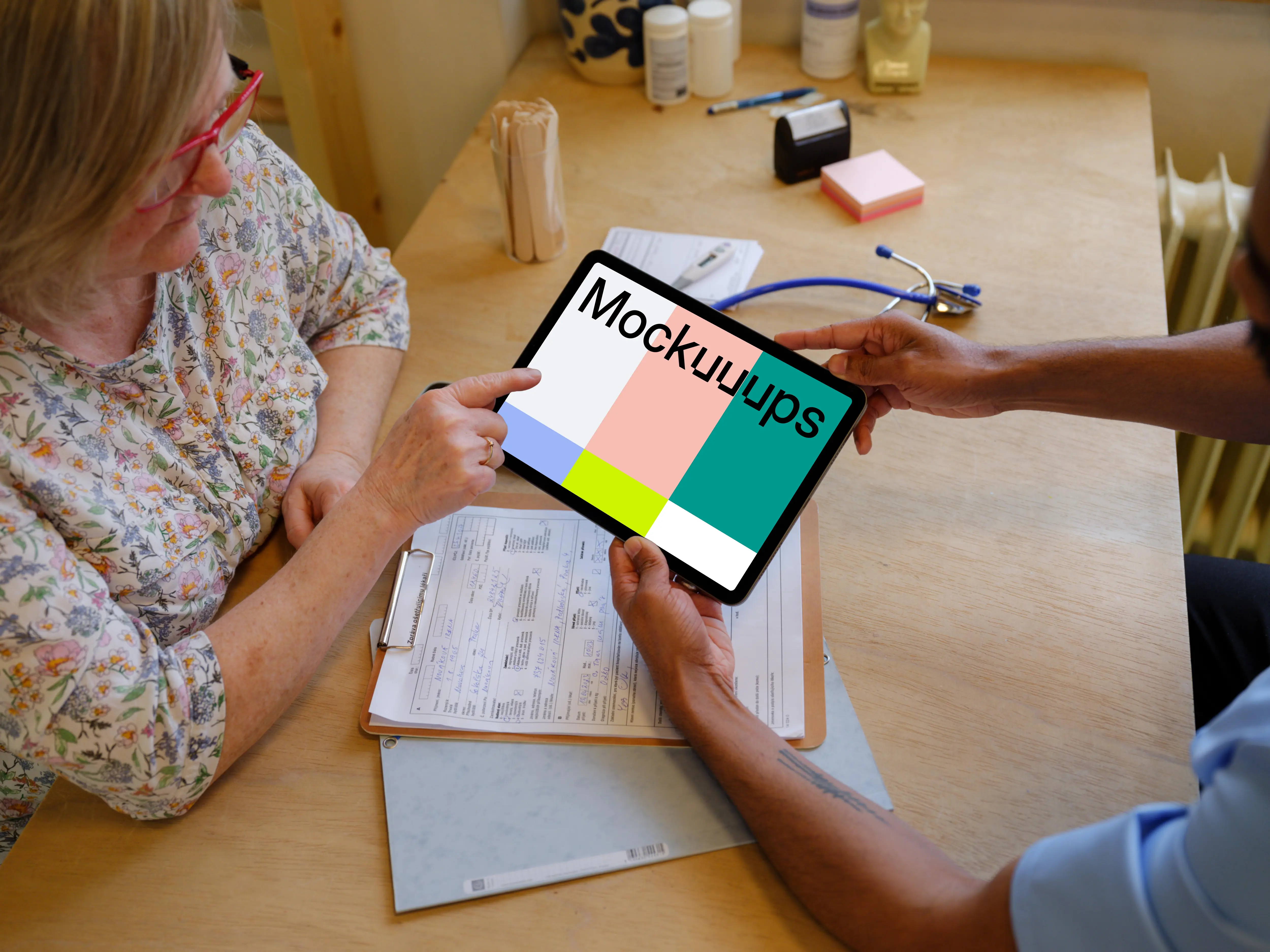 Patient and the doctor with a tablet mockup