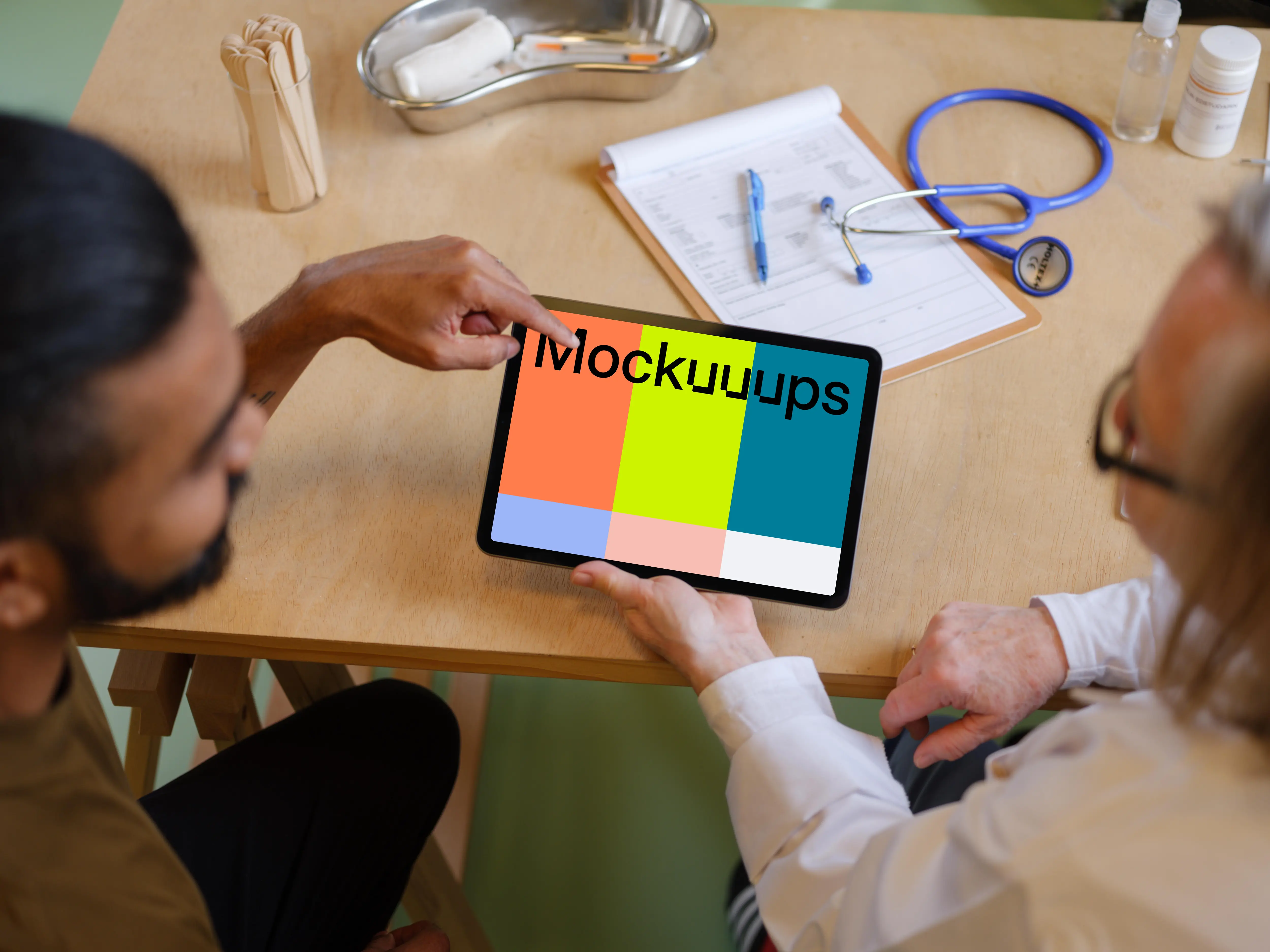 Patient with the doctor and a tablet mockup