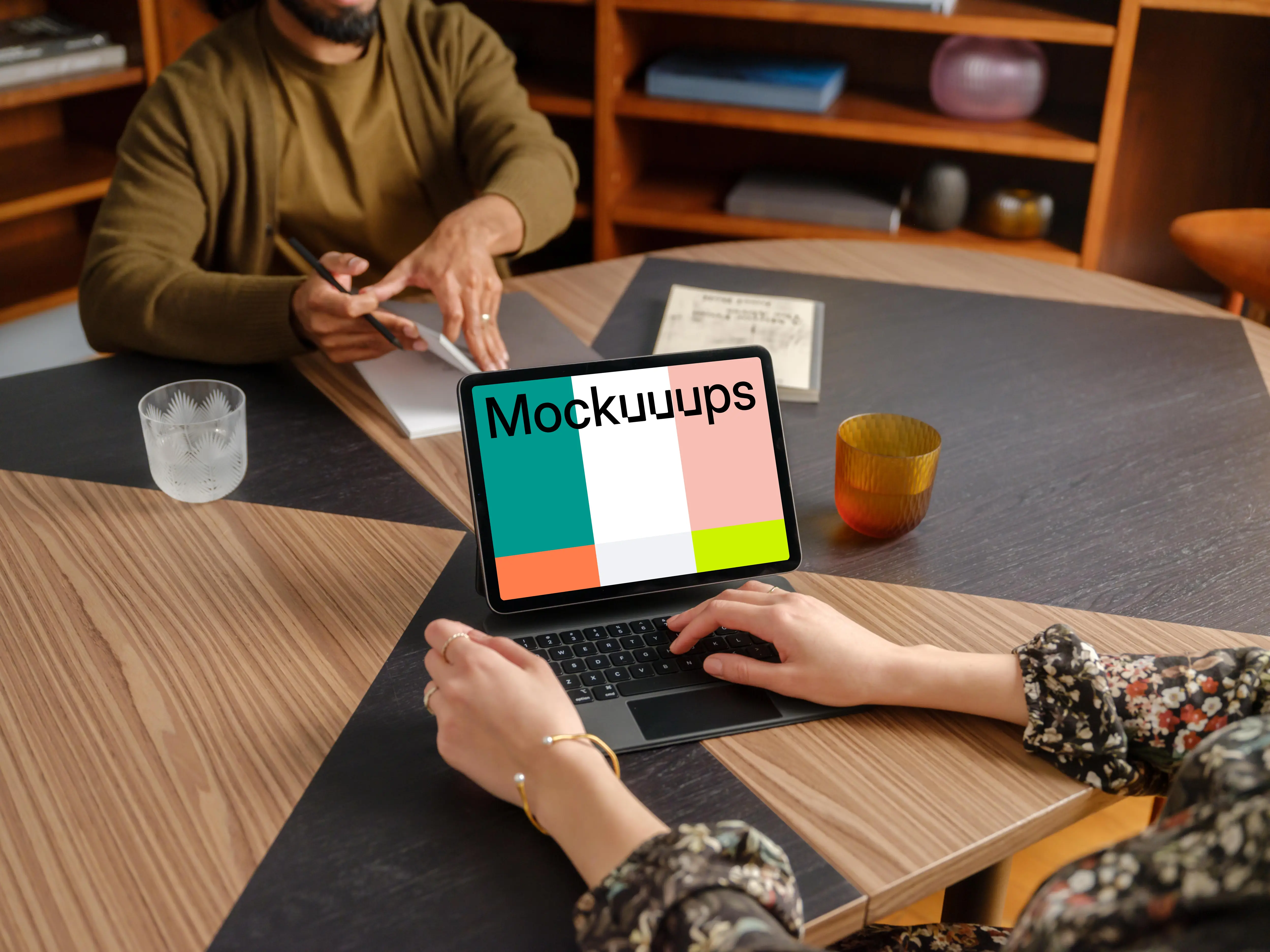 People working in the office with iPad mockup