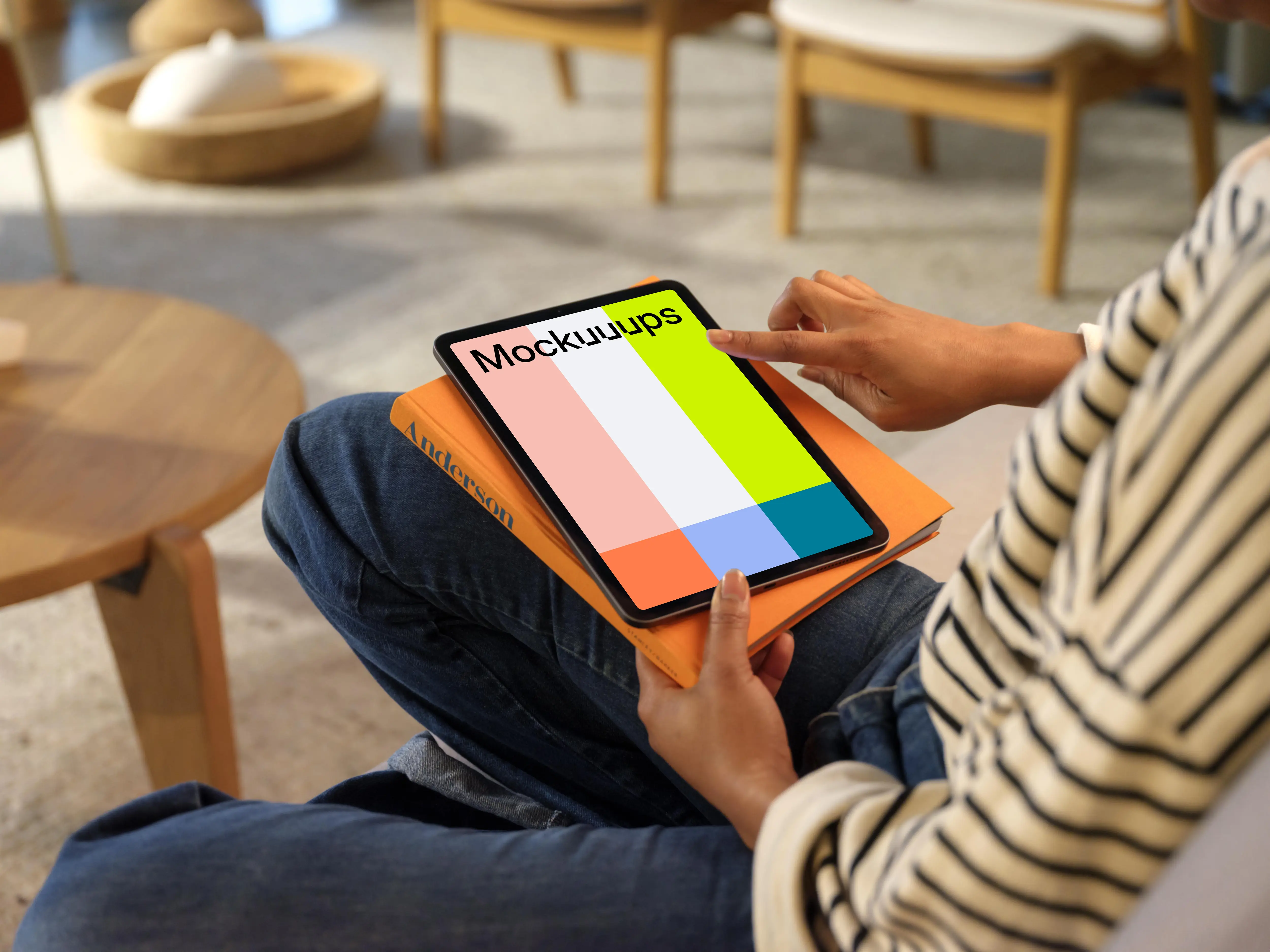 Person scrollin on an iPad Air mockup