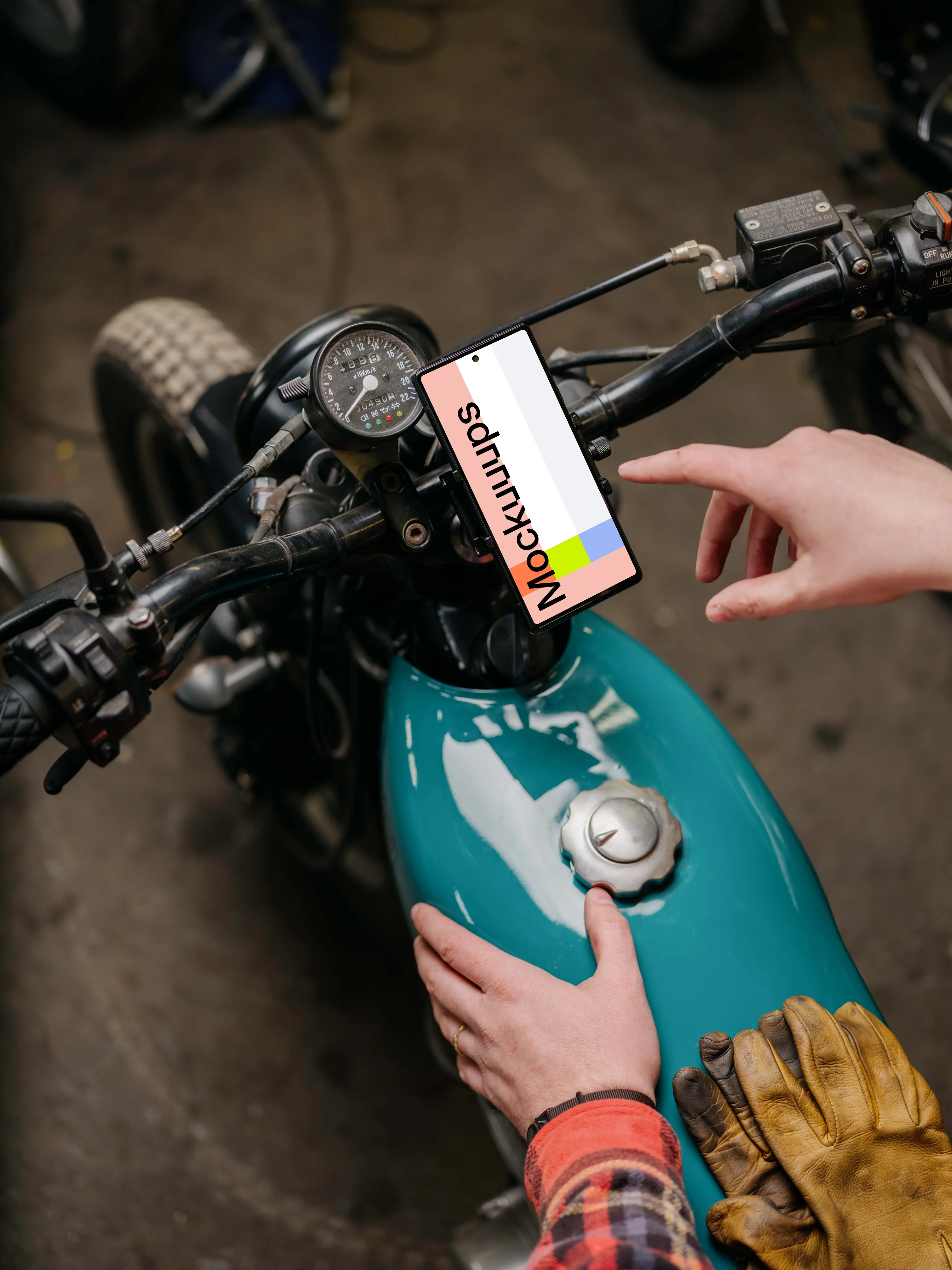 Person using a Pixel 6 mockup on a motorcycle