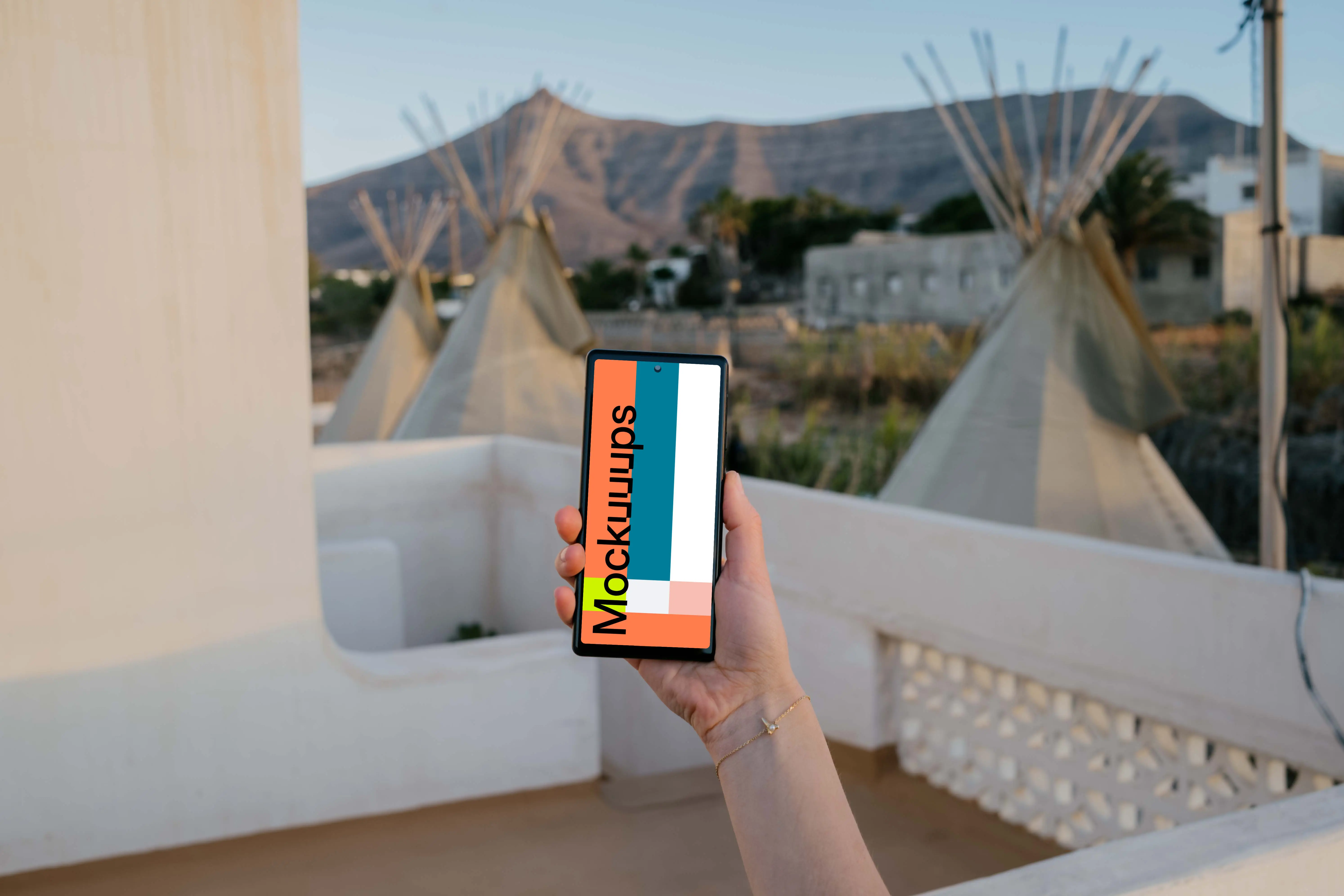 Pixel 6 mockup held in on a balcony