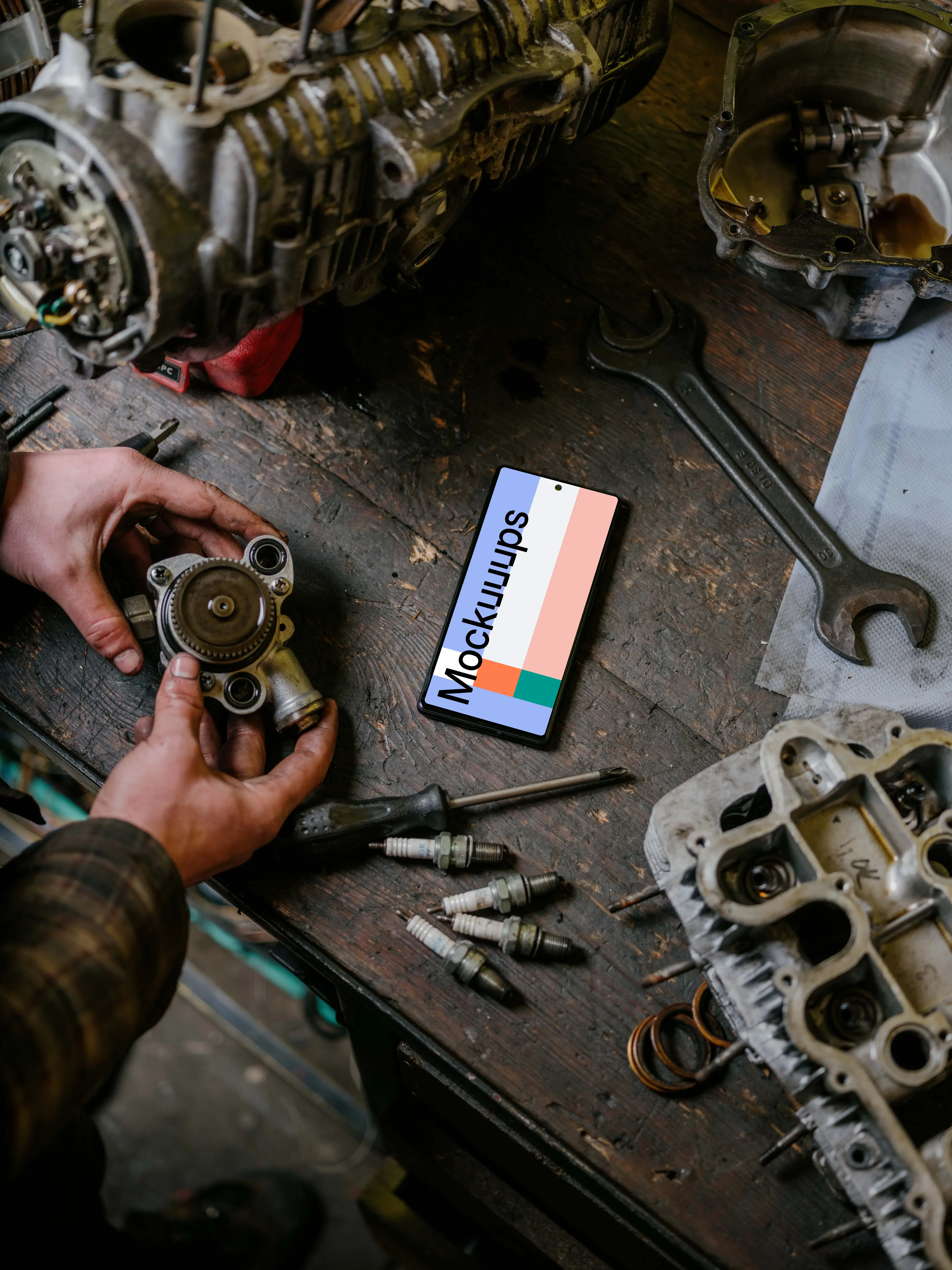 Pixel 6 mockup in front of a man seating at a workbench