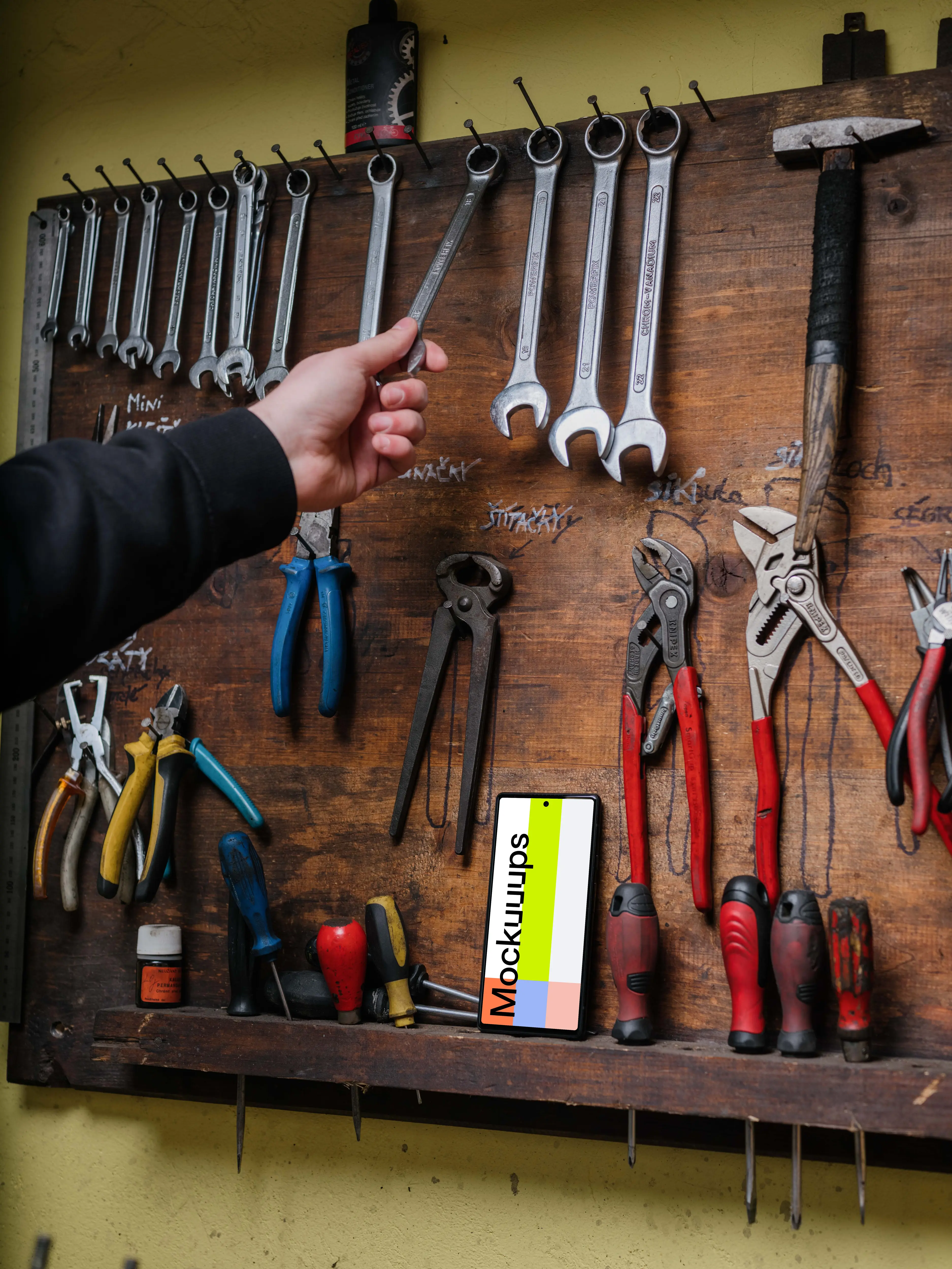 Pixel 6 mockup leaning on a tool rack