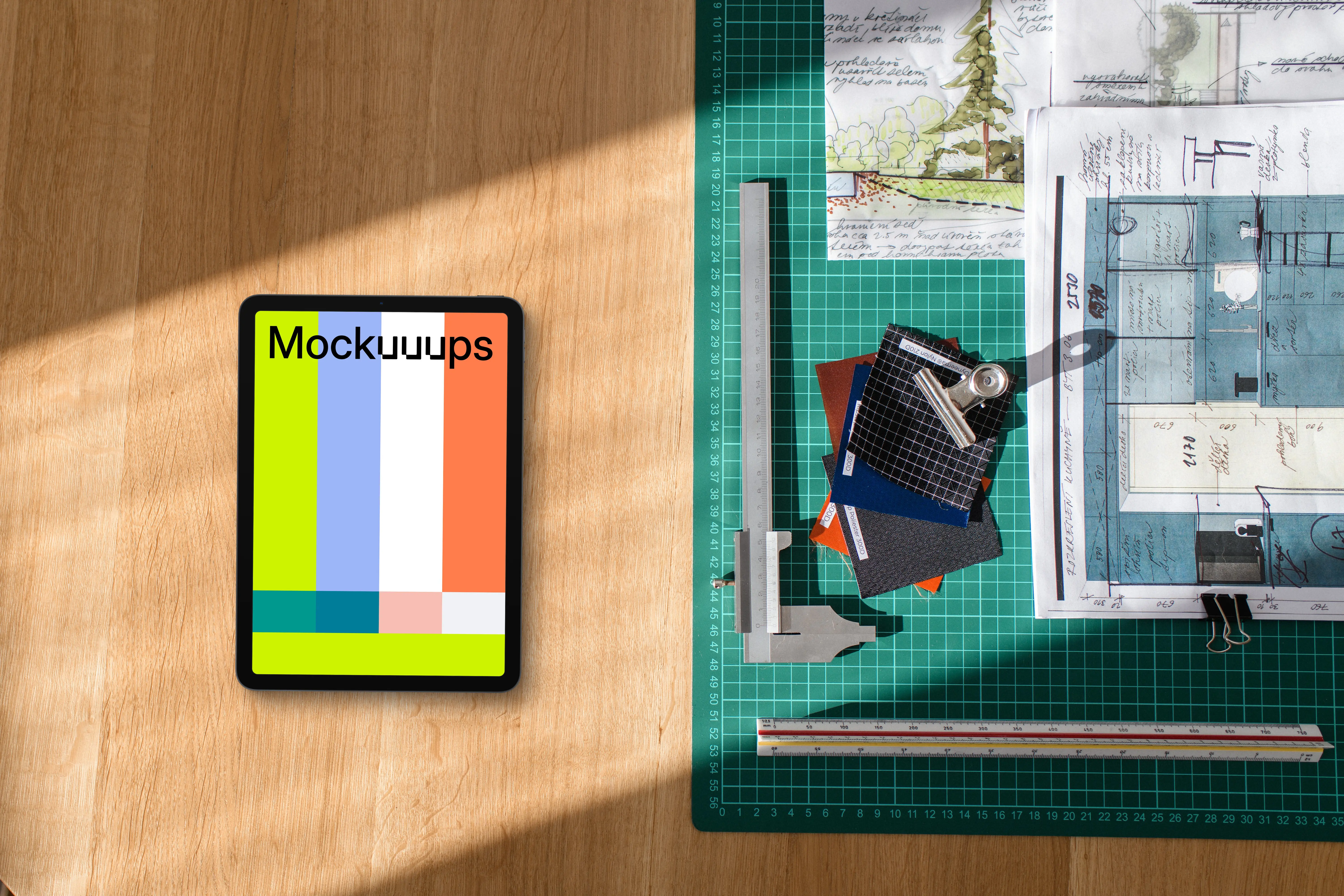 Tablet mockup among architect's tools