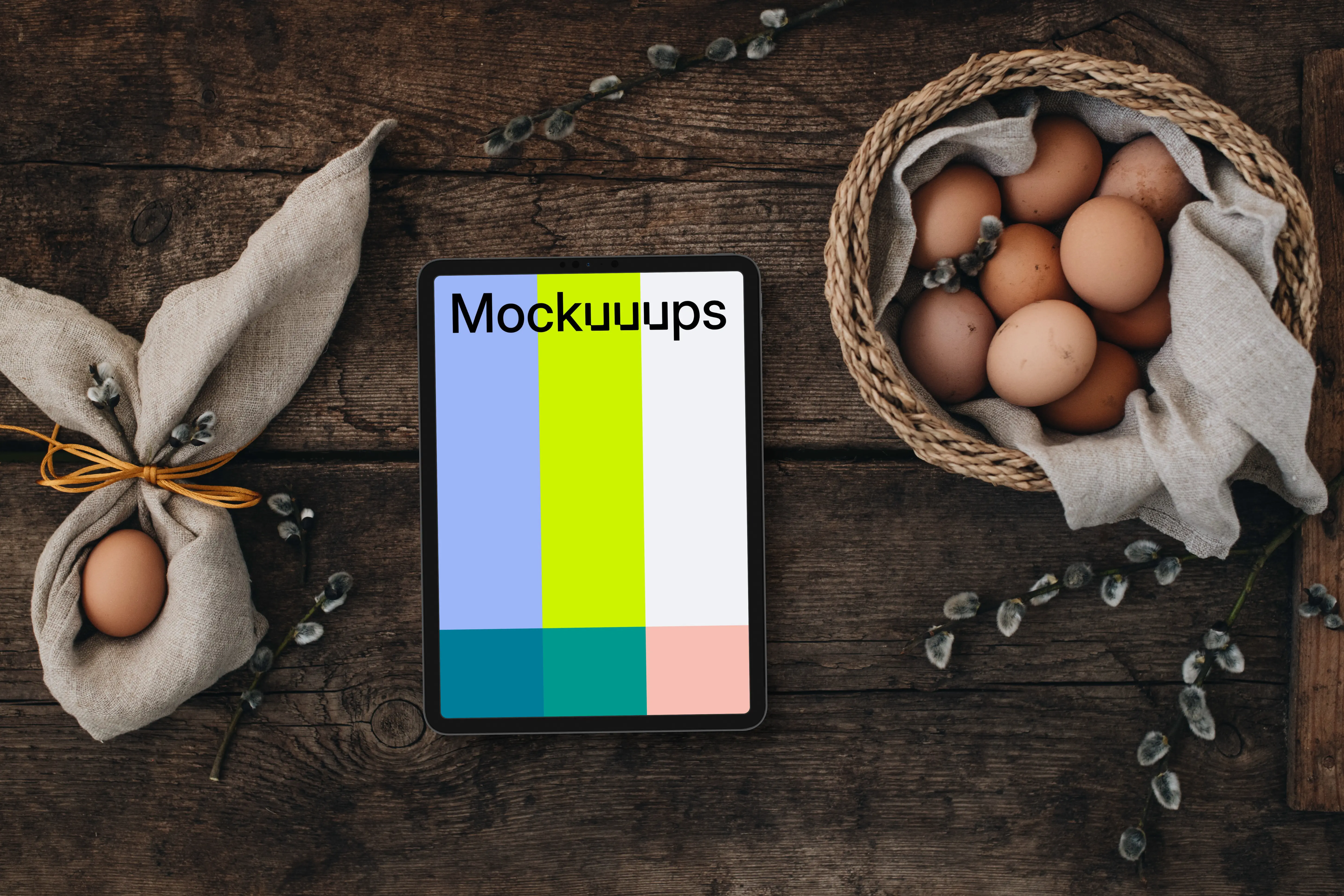 Tablet mockup among eggs for the Easter season