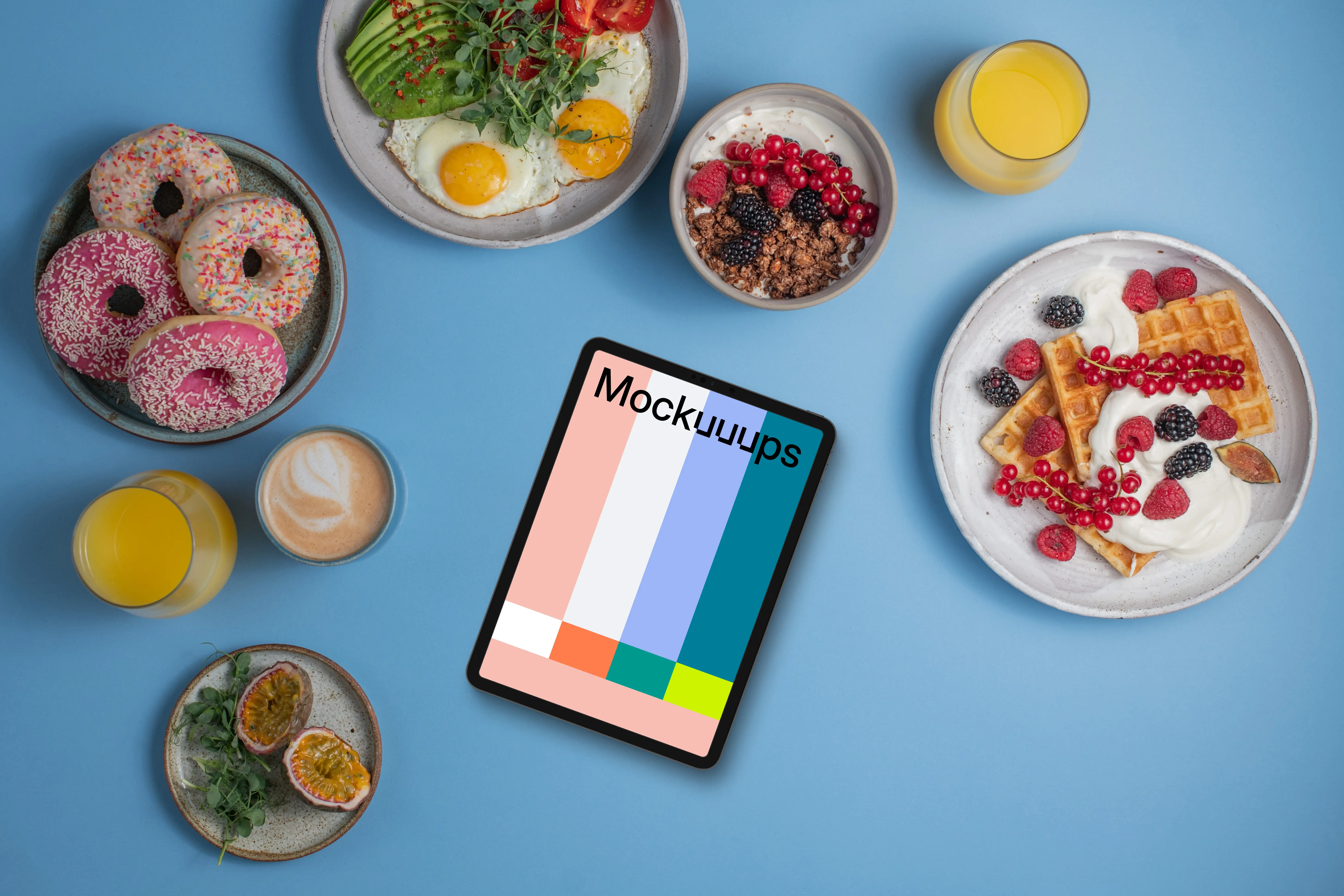 Tablet mockup around delicious breakfast meals