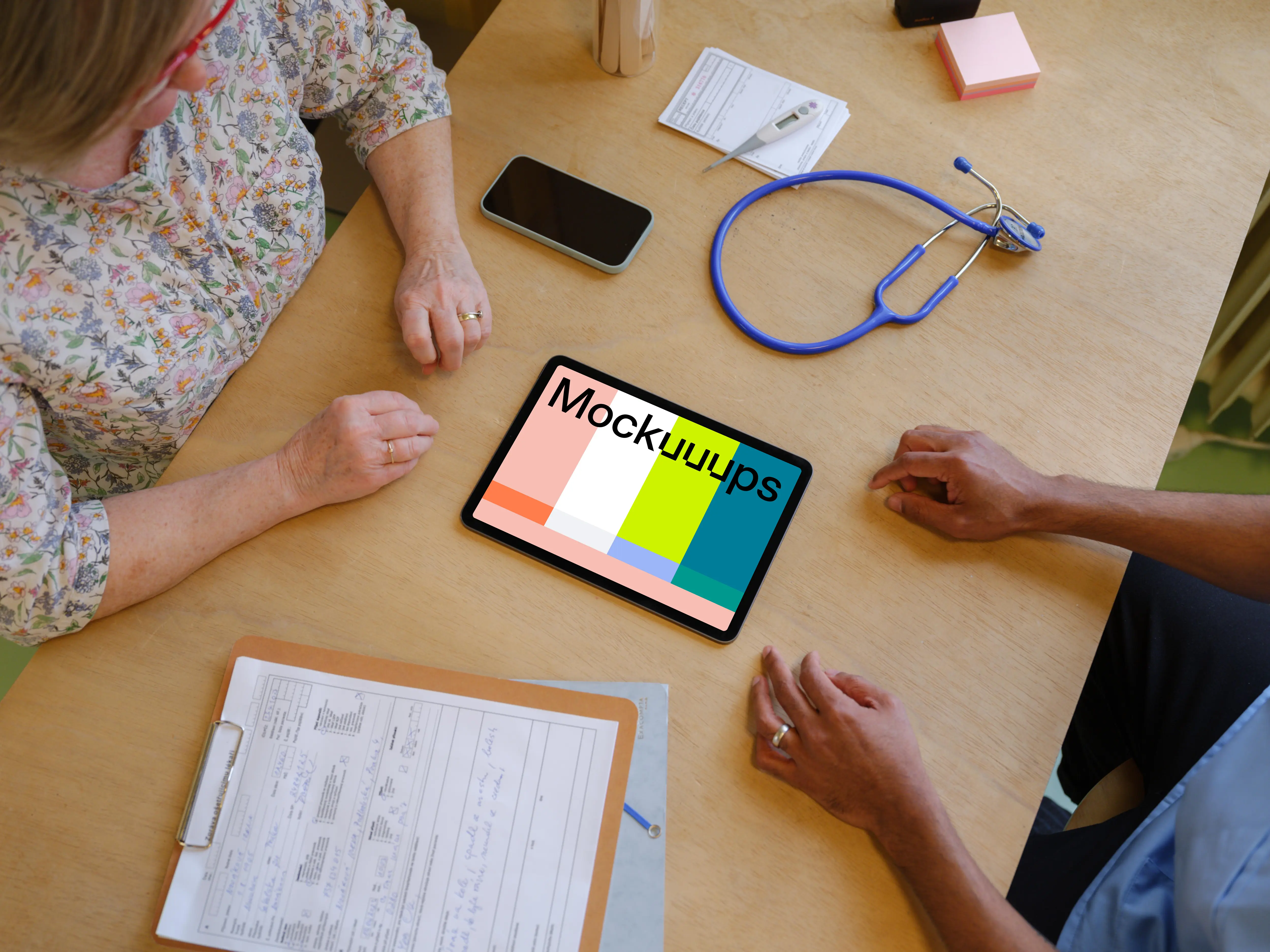 Tablet mockup between doctor and the patient