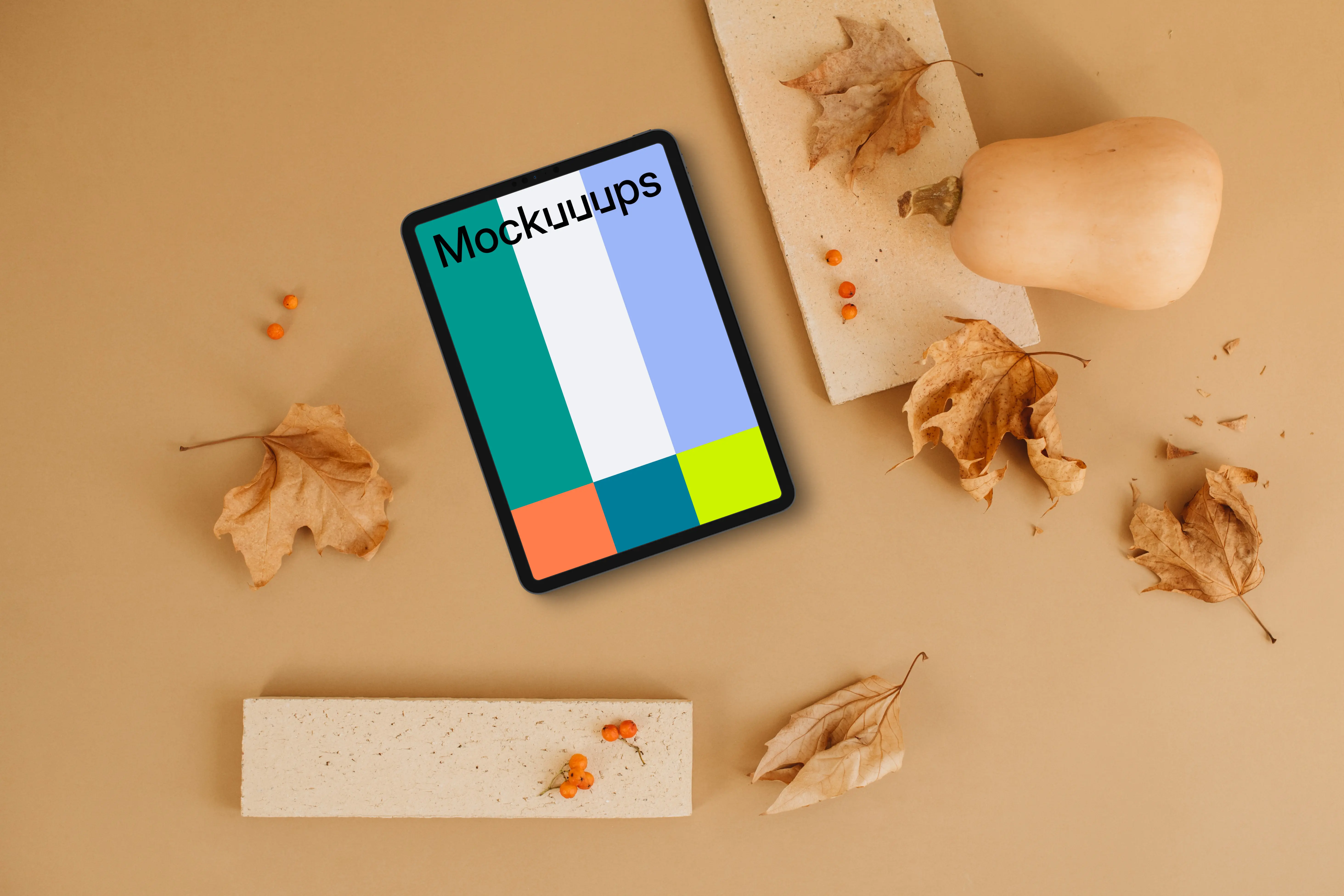 Tablet mockup next to the brick and pumpkin