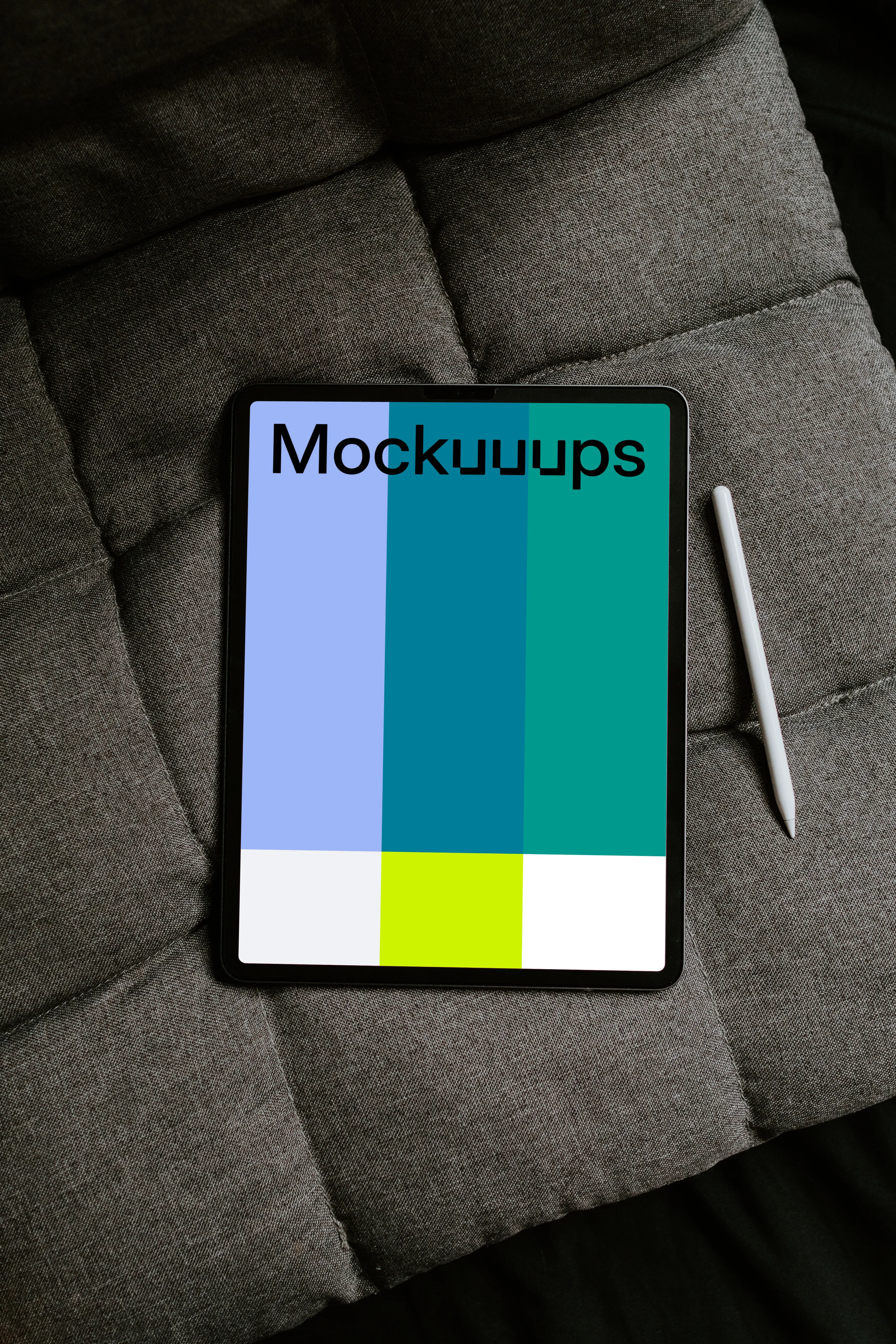 Tablet mockup on an gray sofa