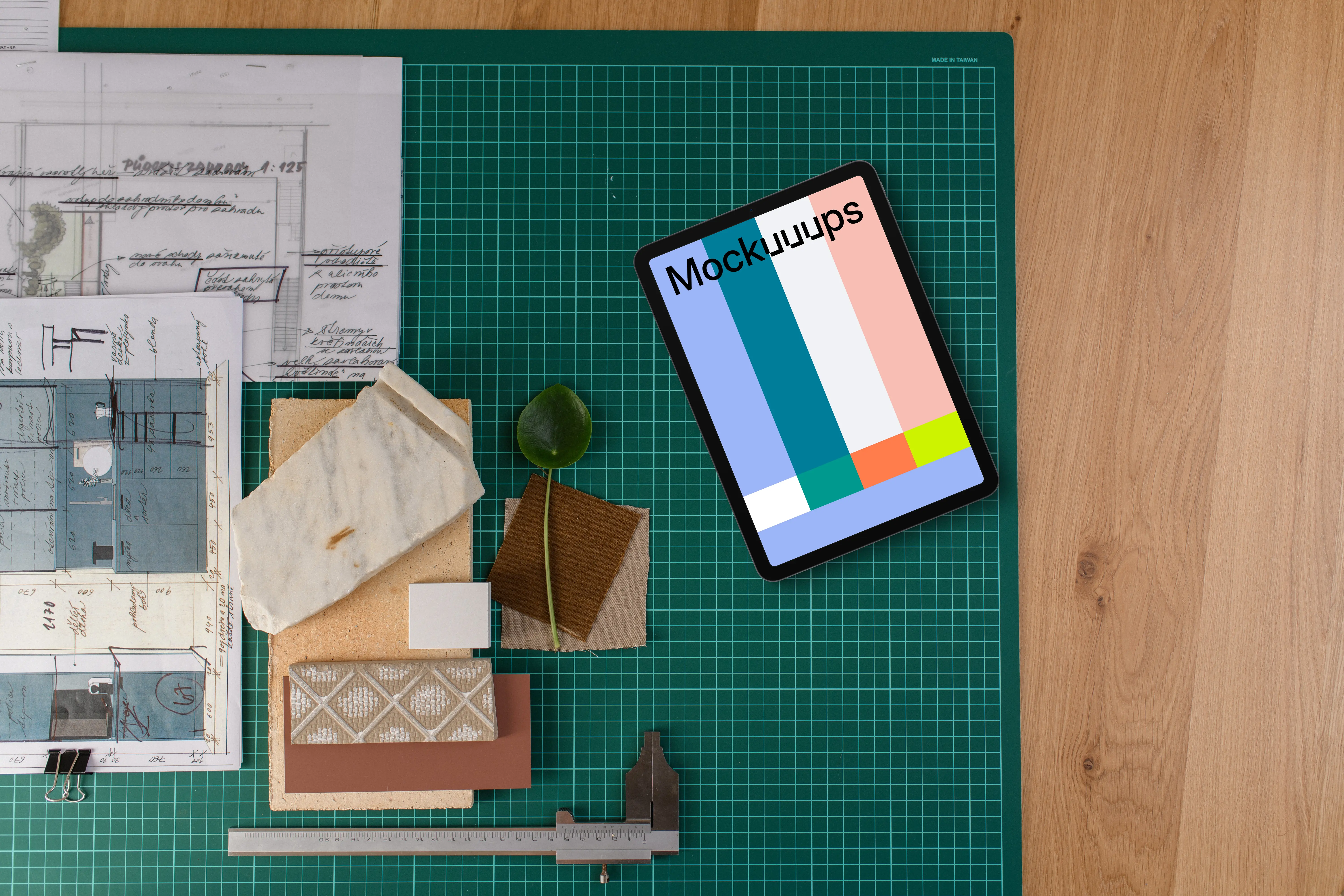 Tablet mockup on architect's planning table