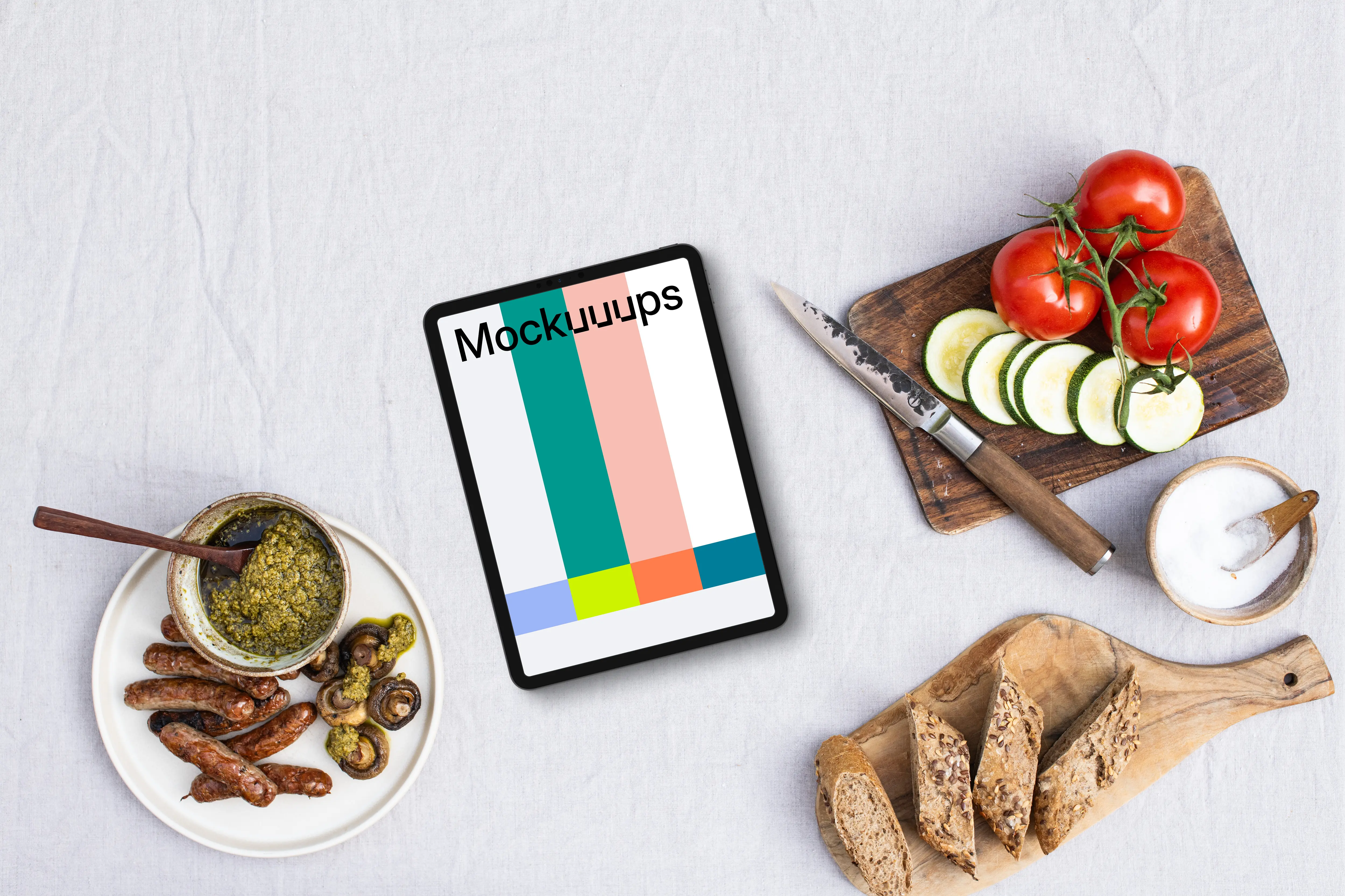 Tablet mockup surrounded by barbecue essentials