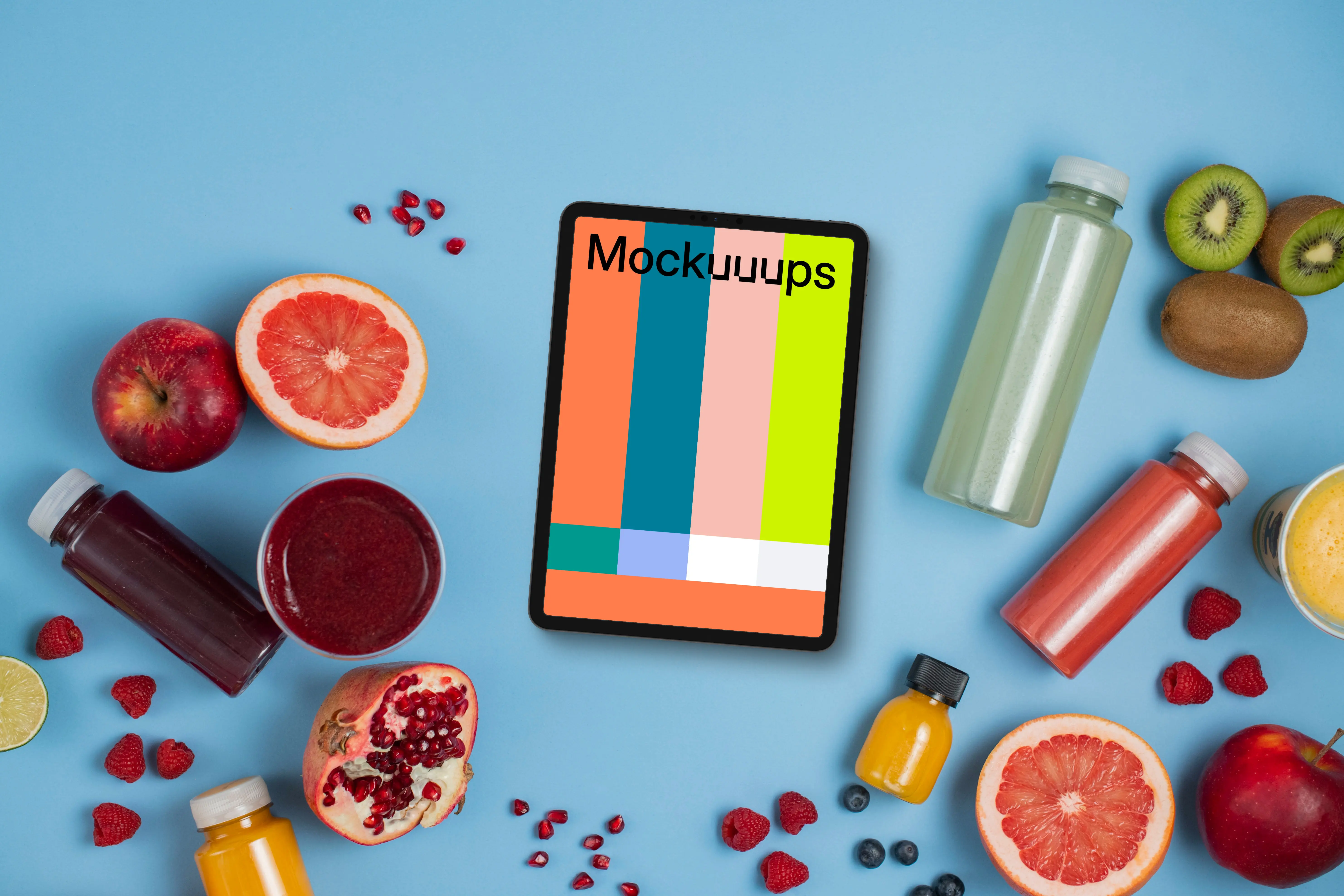Tablet mockup surrounded by juices and fruit