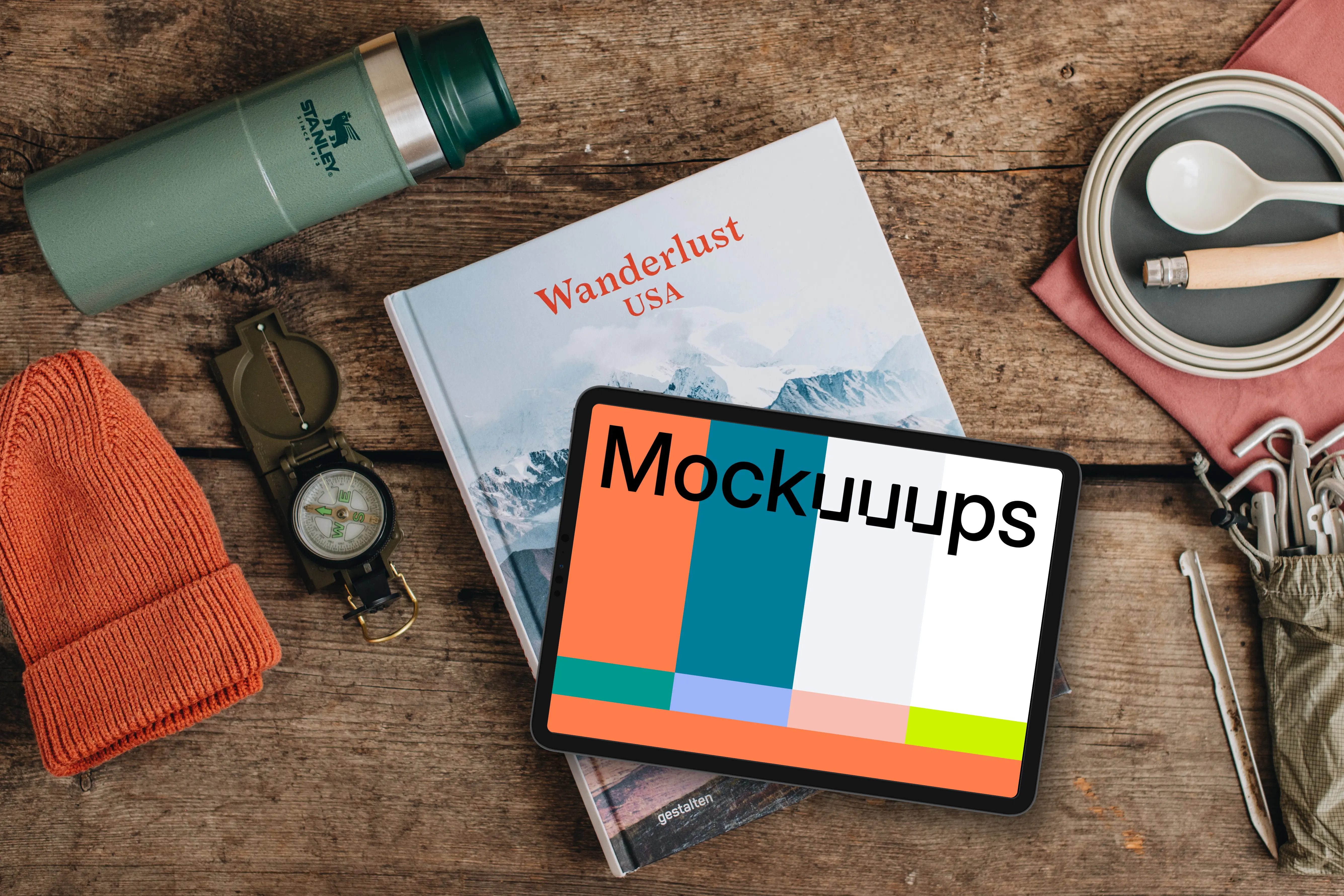 Tablet mockup with hiking supplies