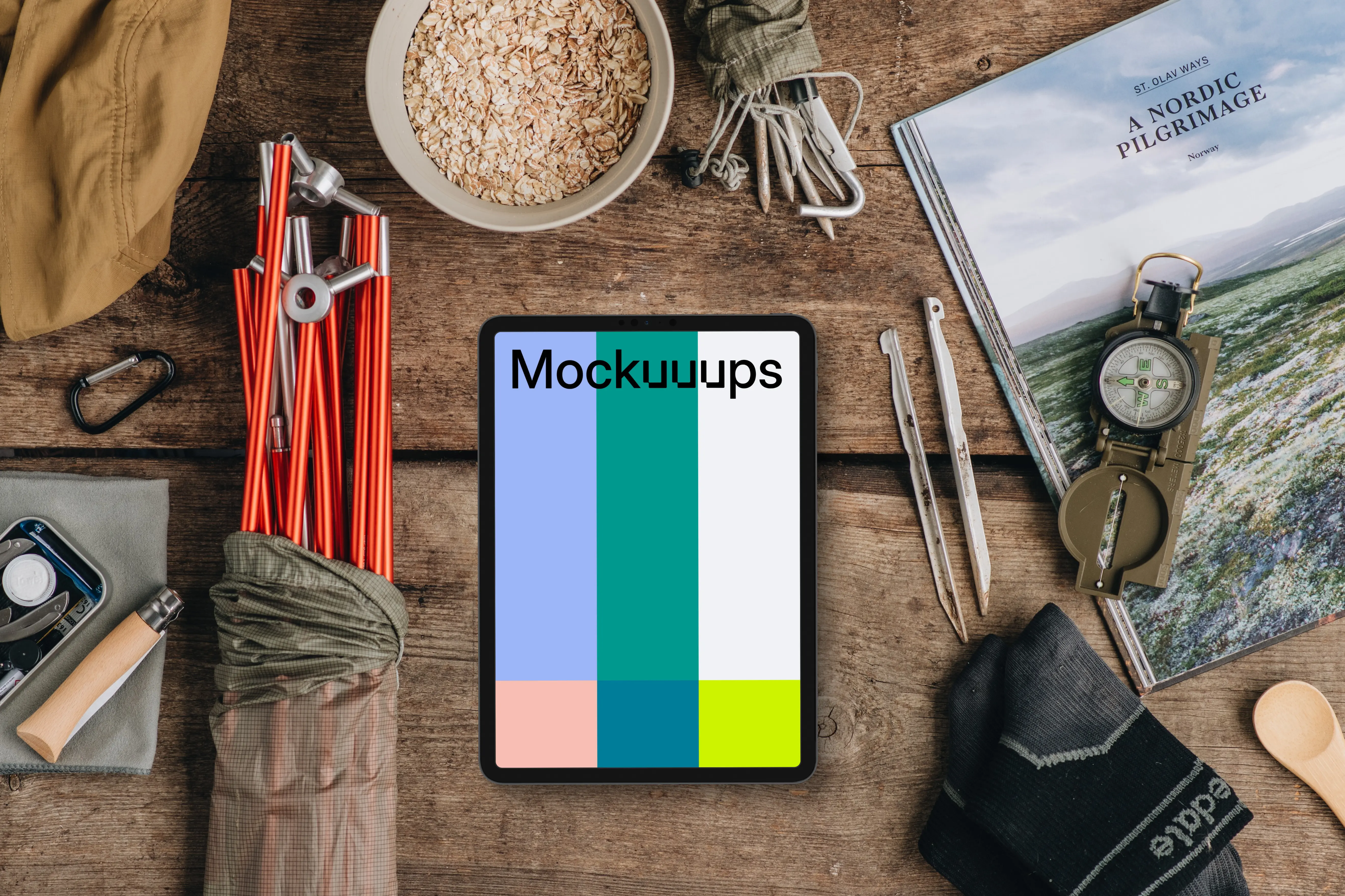 Tablet mockup with outdoor hike supplies