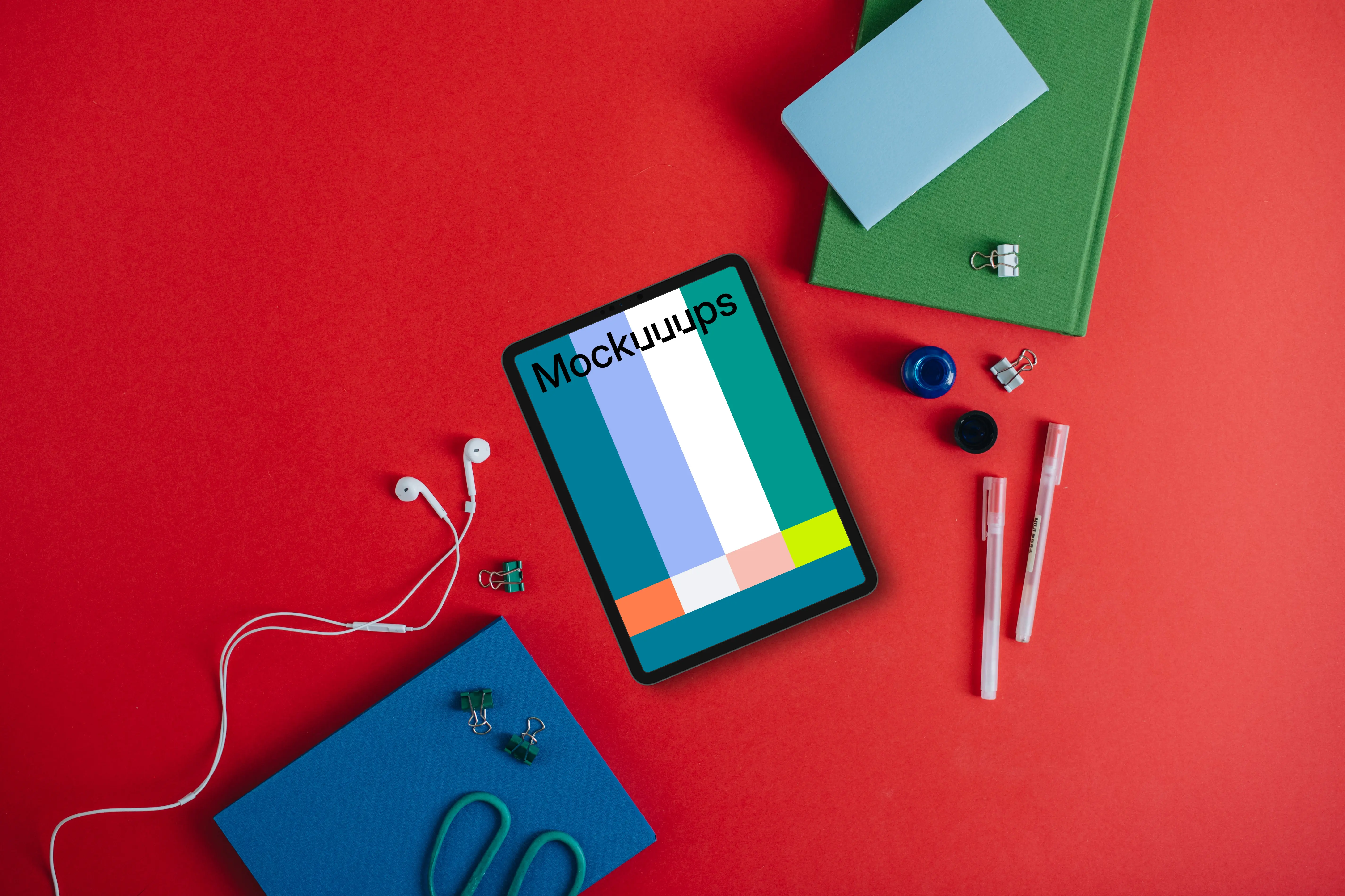 Tablet mockup with pencils and notebook on the side