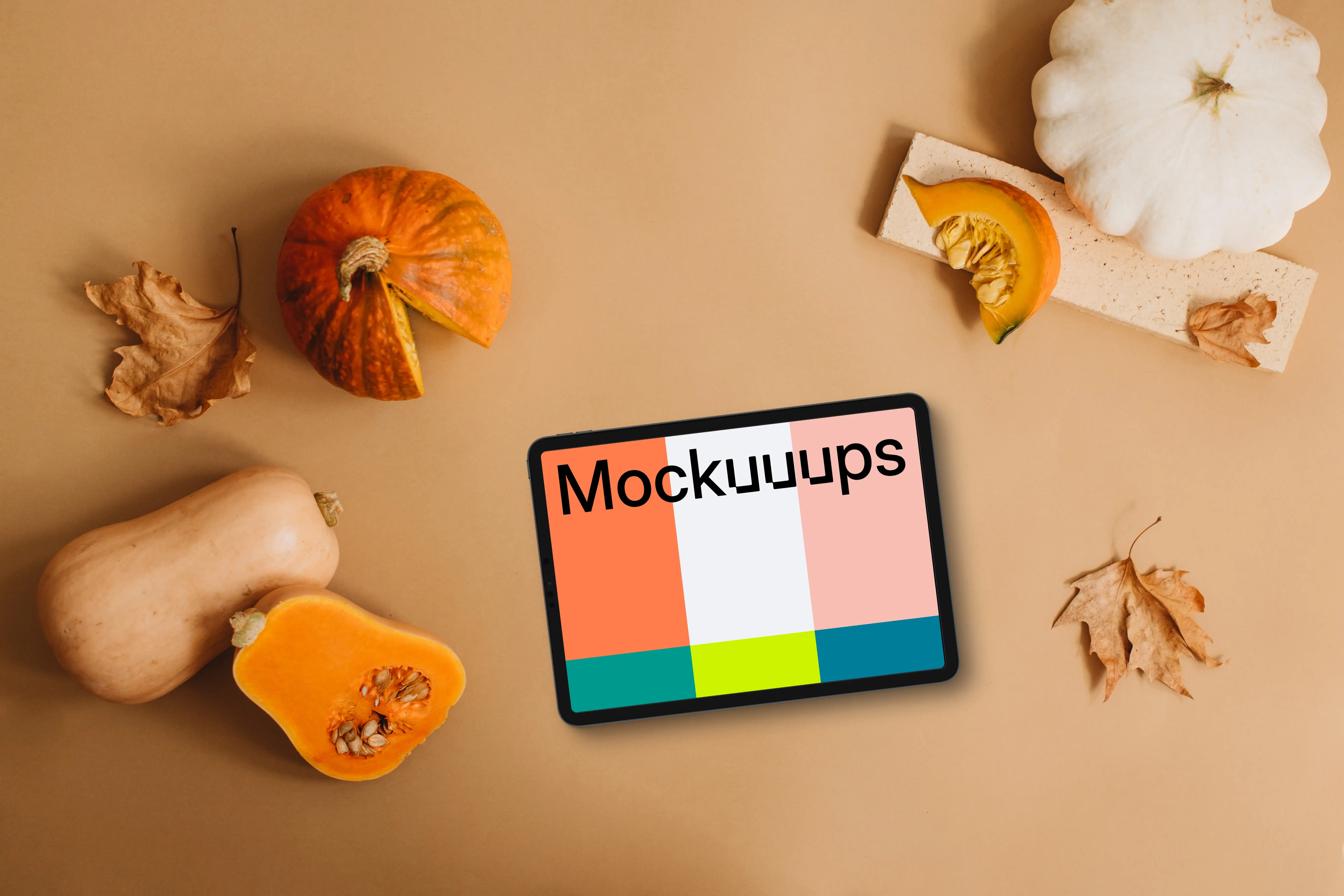 Top view of tablet mockup with pumpkins
