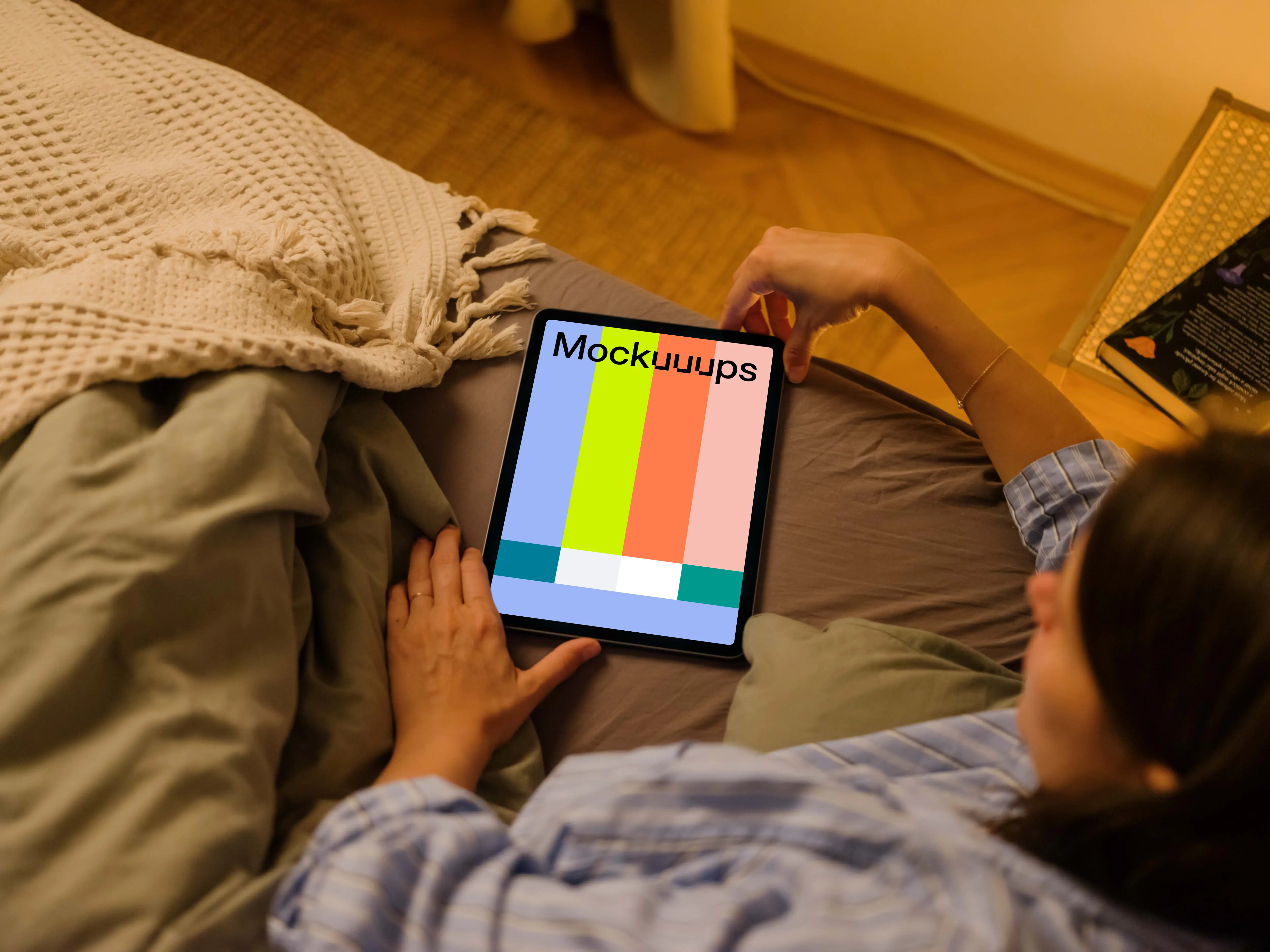 User holding an iPad Air mockup