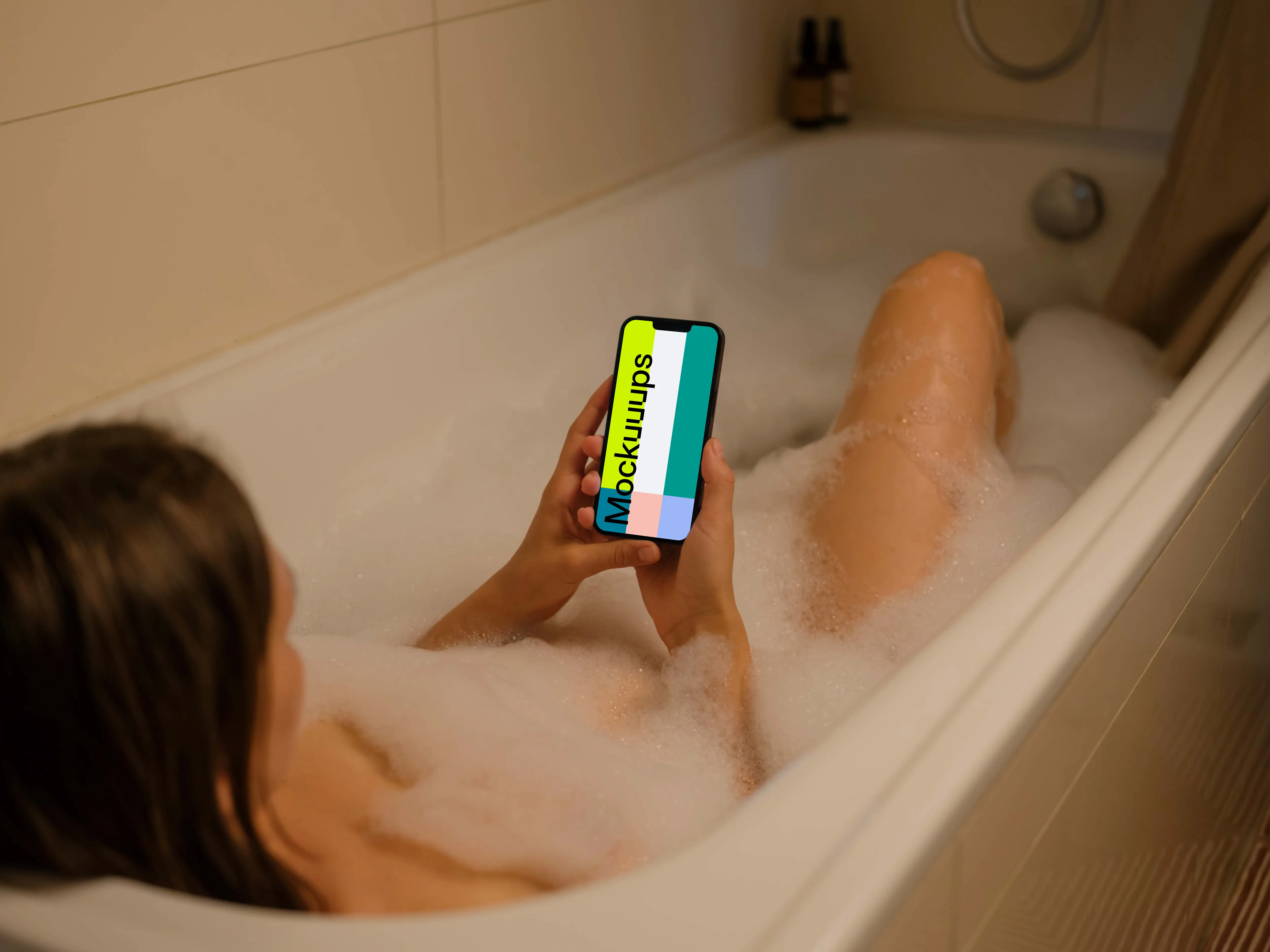 User's hands holding an iPhone 13 mockup