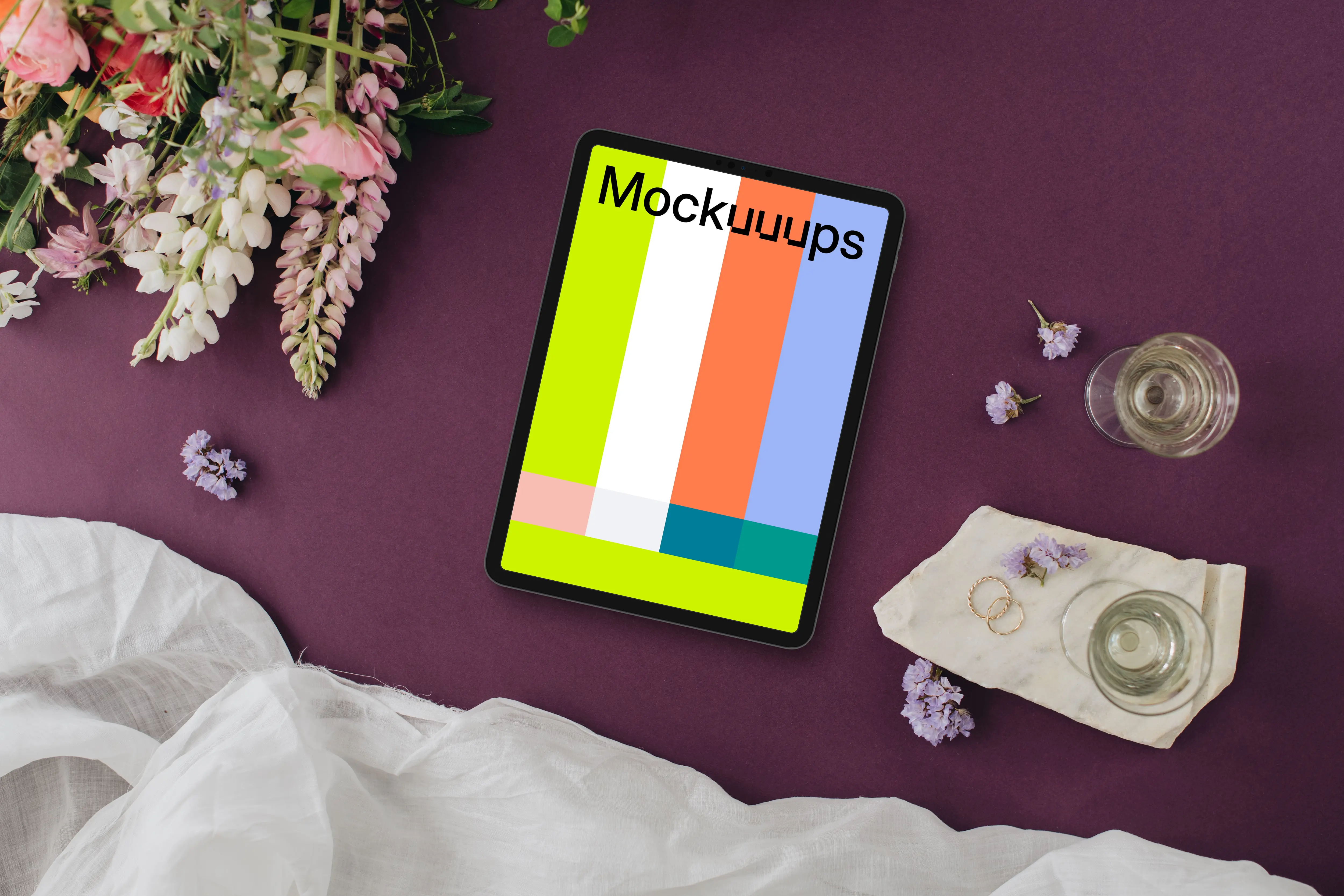 Wedding bliss with iPad mockup, rings, and flowers