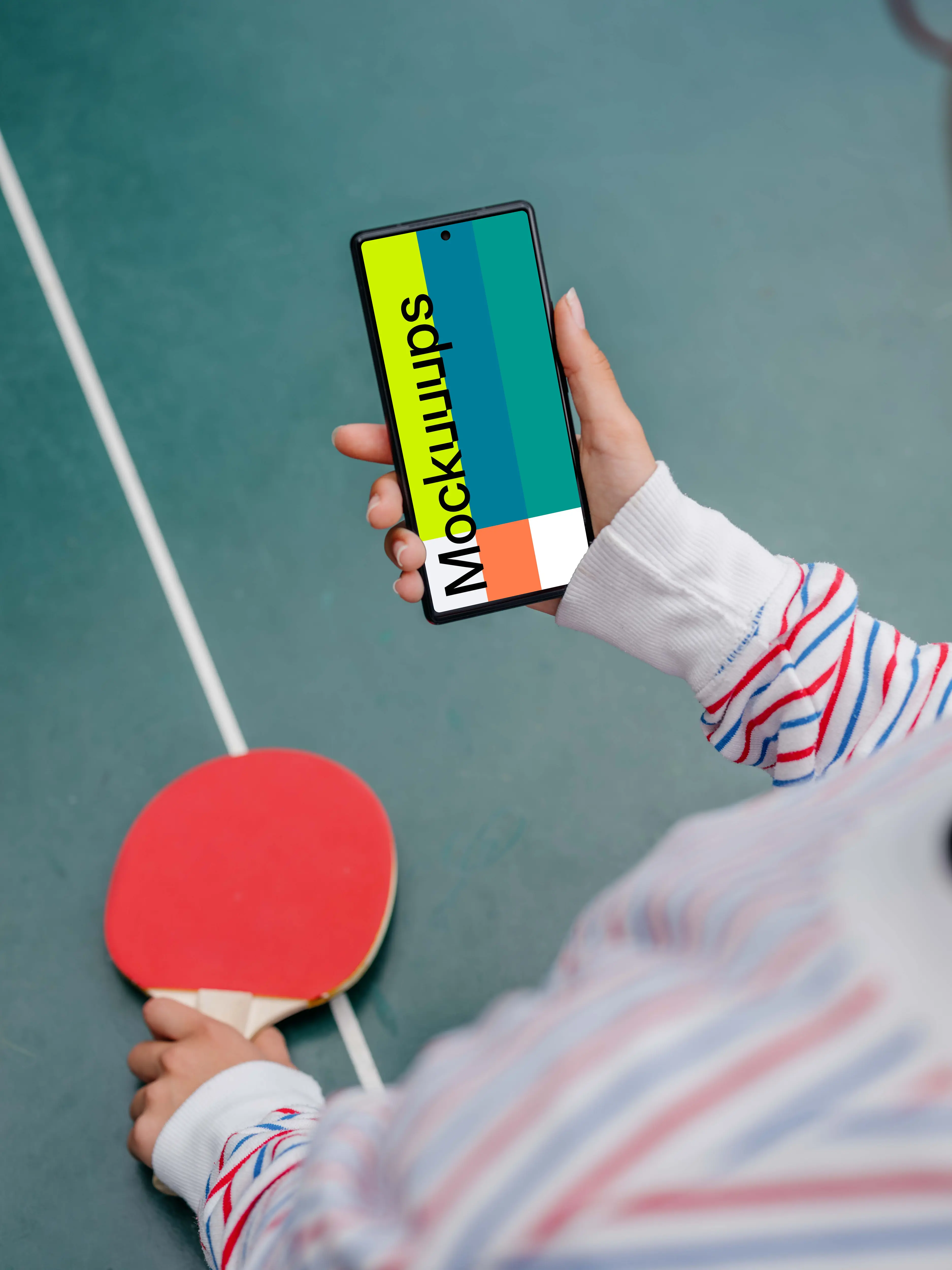 Woman hand holding a phone mockup while playing ping-pong