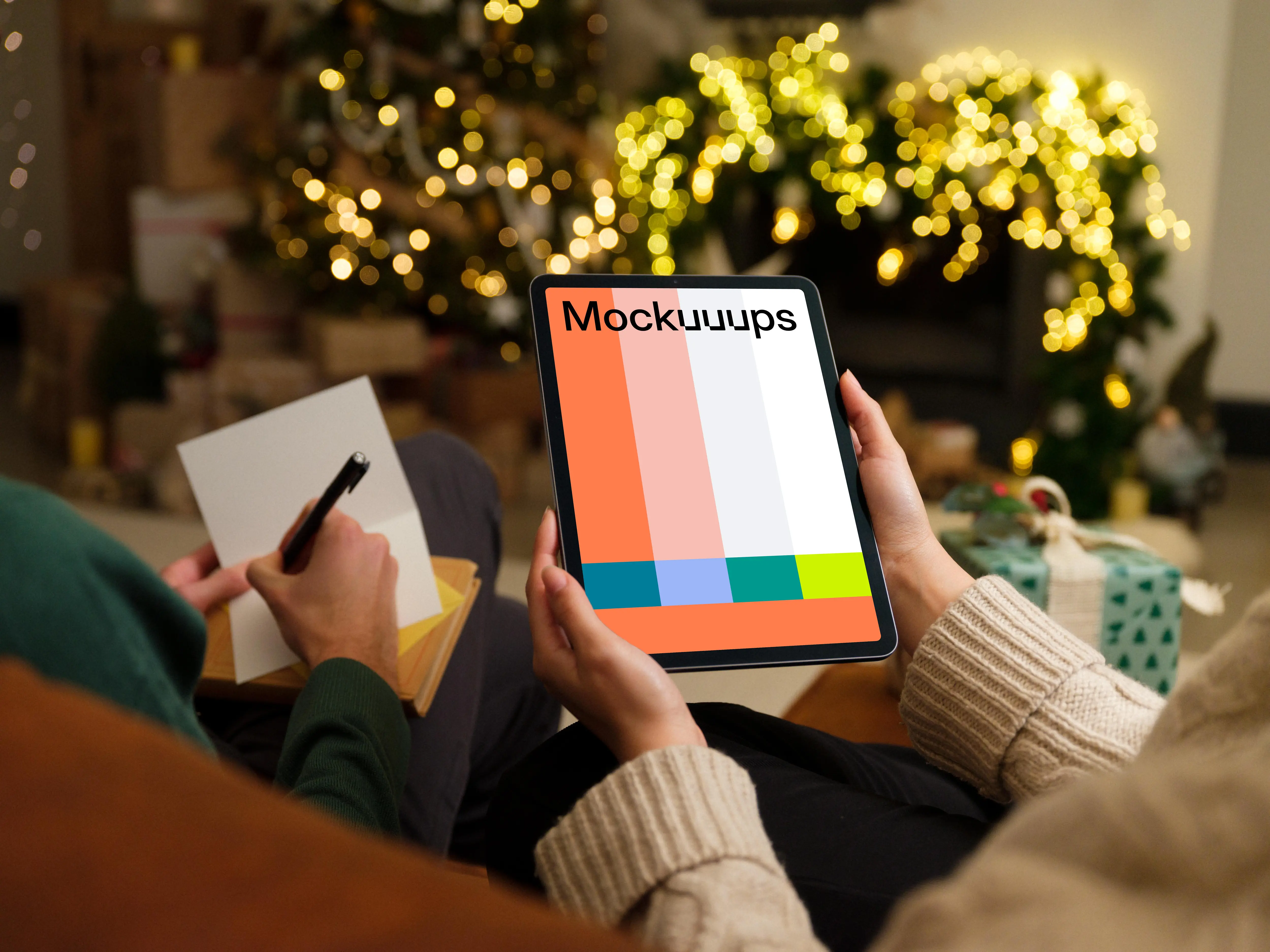 Woman holding a tablet mockup with Christmas decor