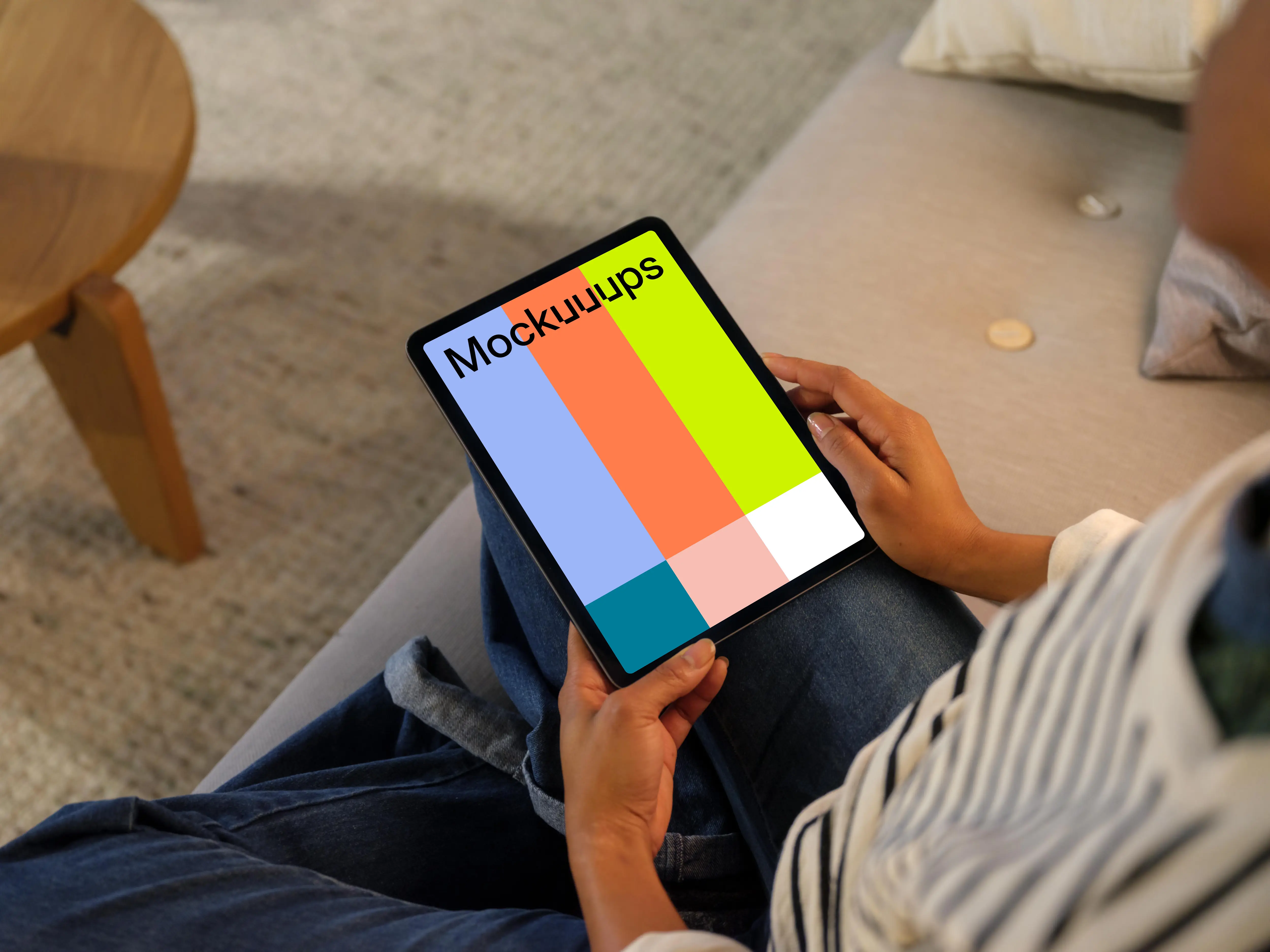 Woman holding an iPad Air mockup in cozy place