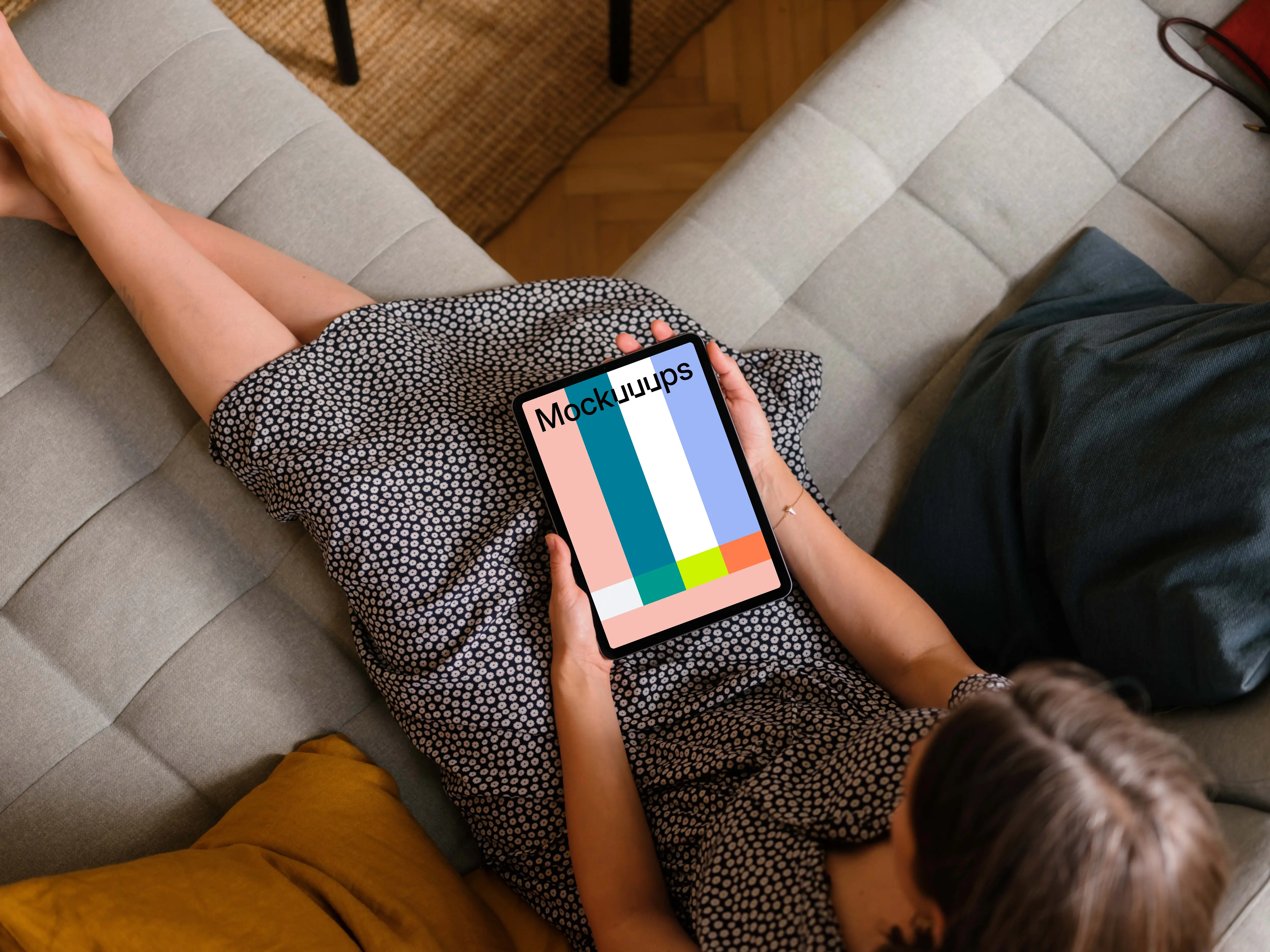 Woman holding an iPad Air mockup