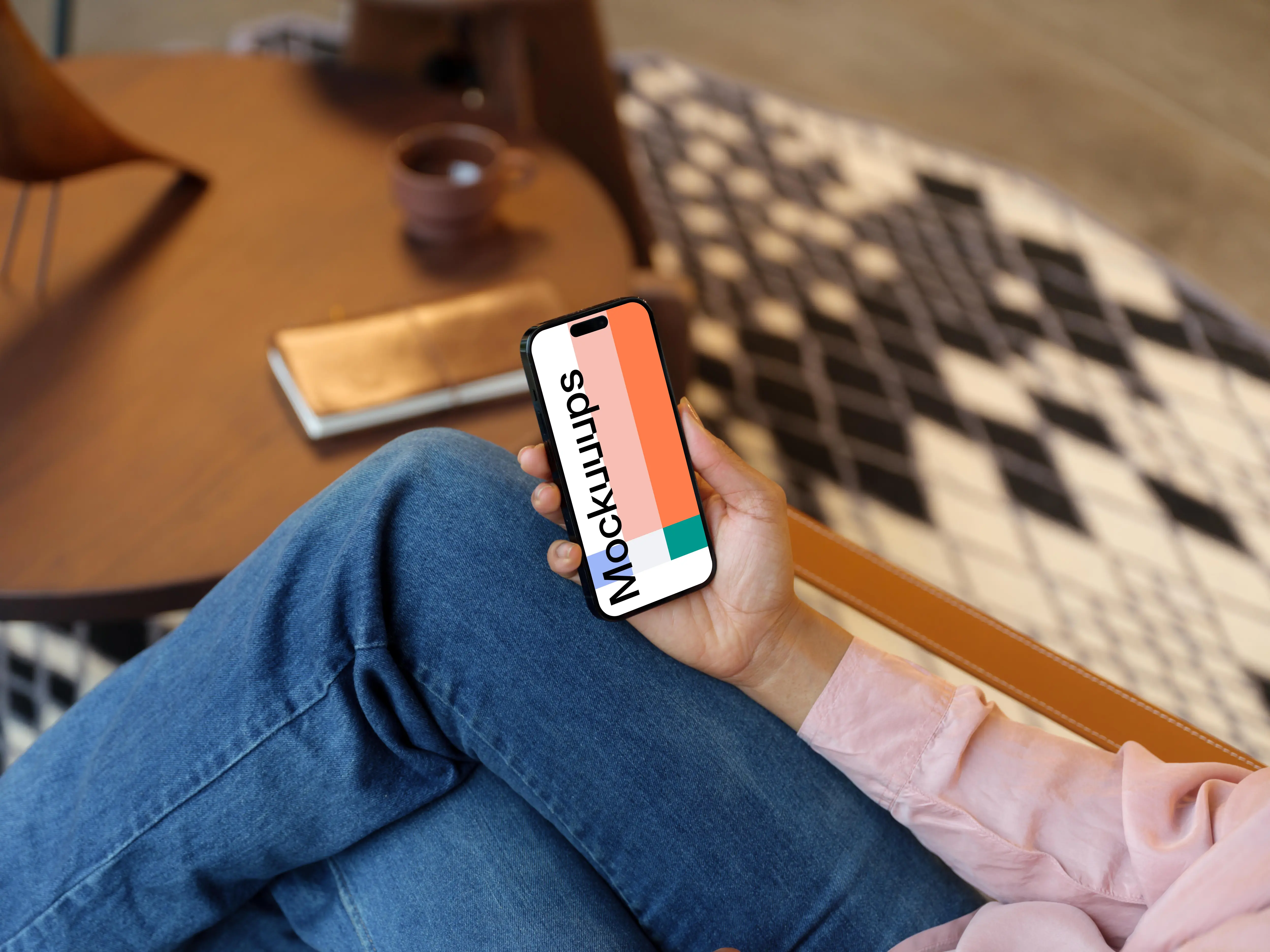 Woman holding an iPhone mockup