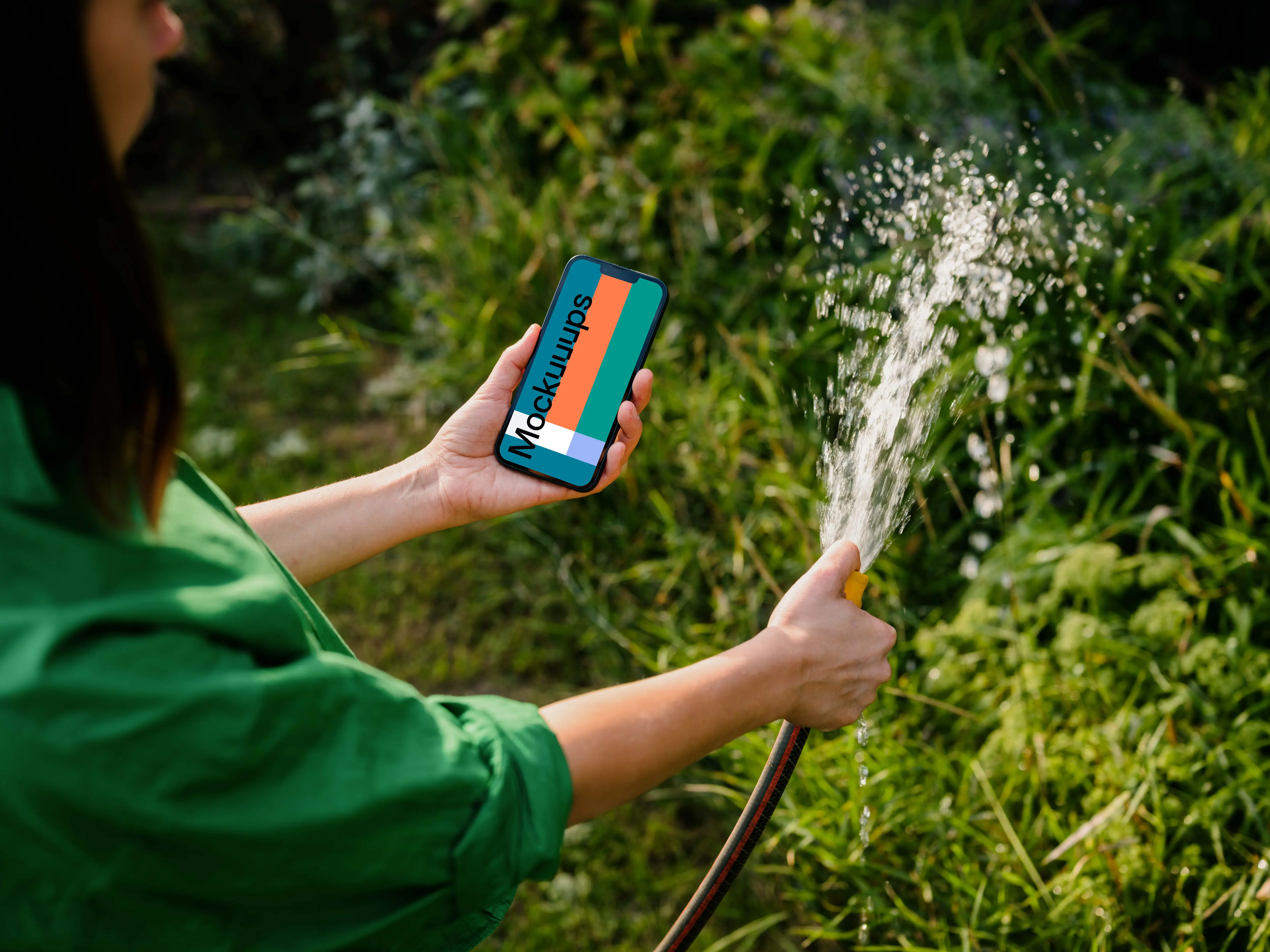 Woman holding an iPhone while watering plants mockup