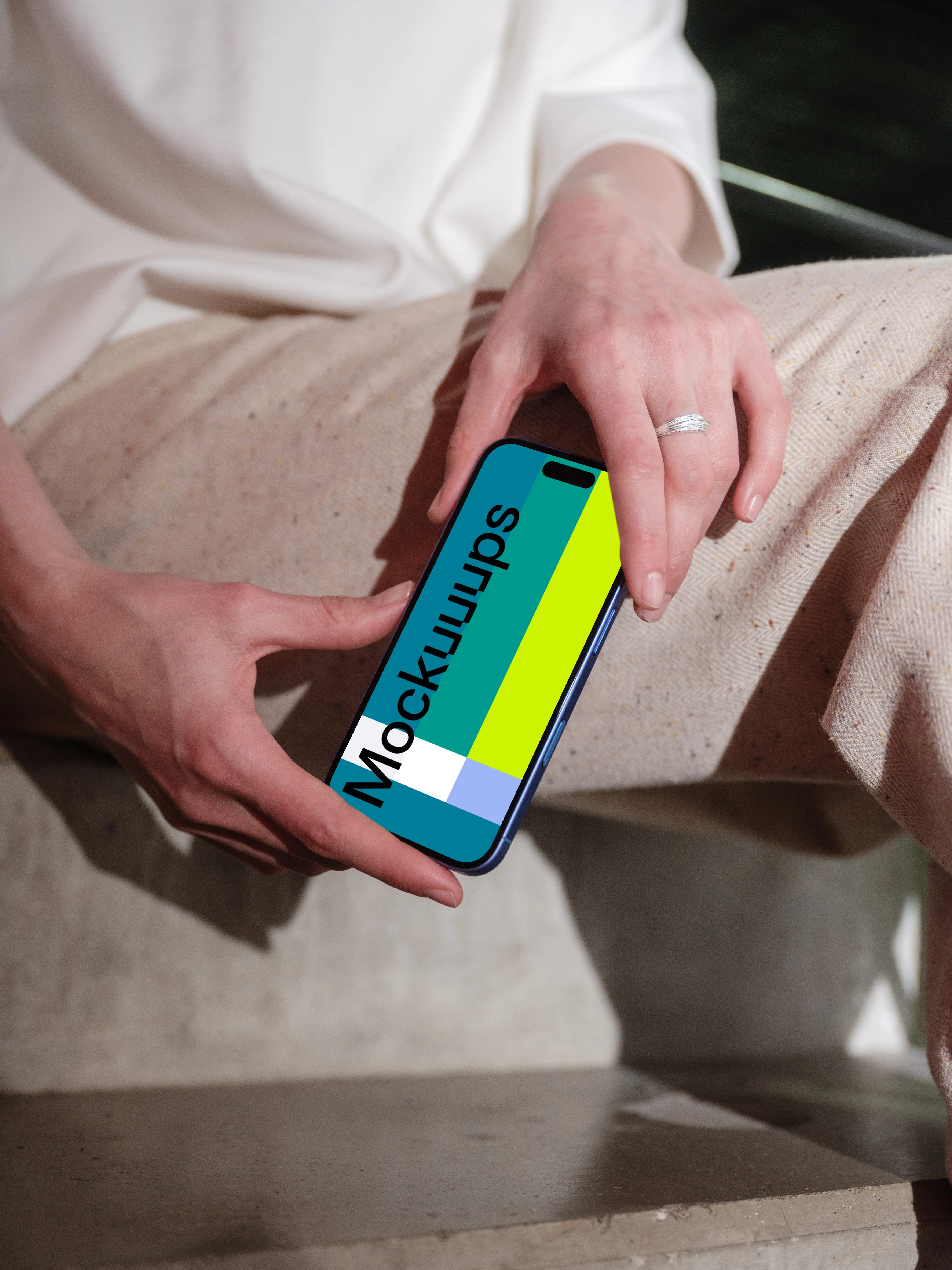 Woman holding iPhone 16