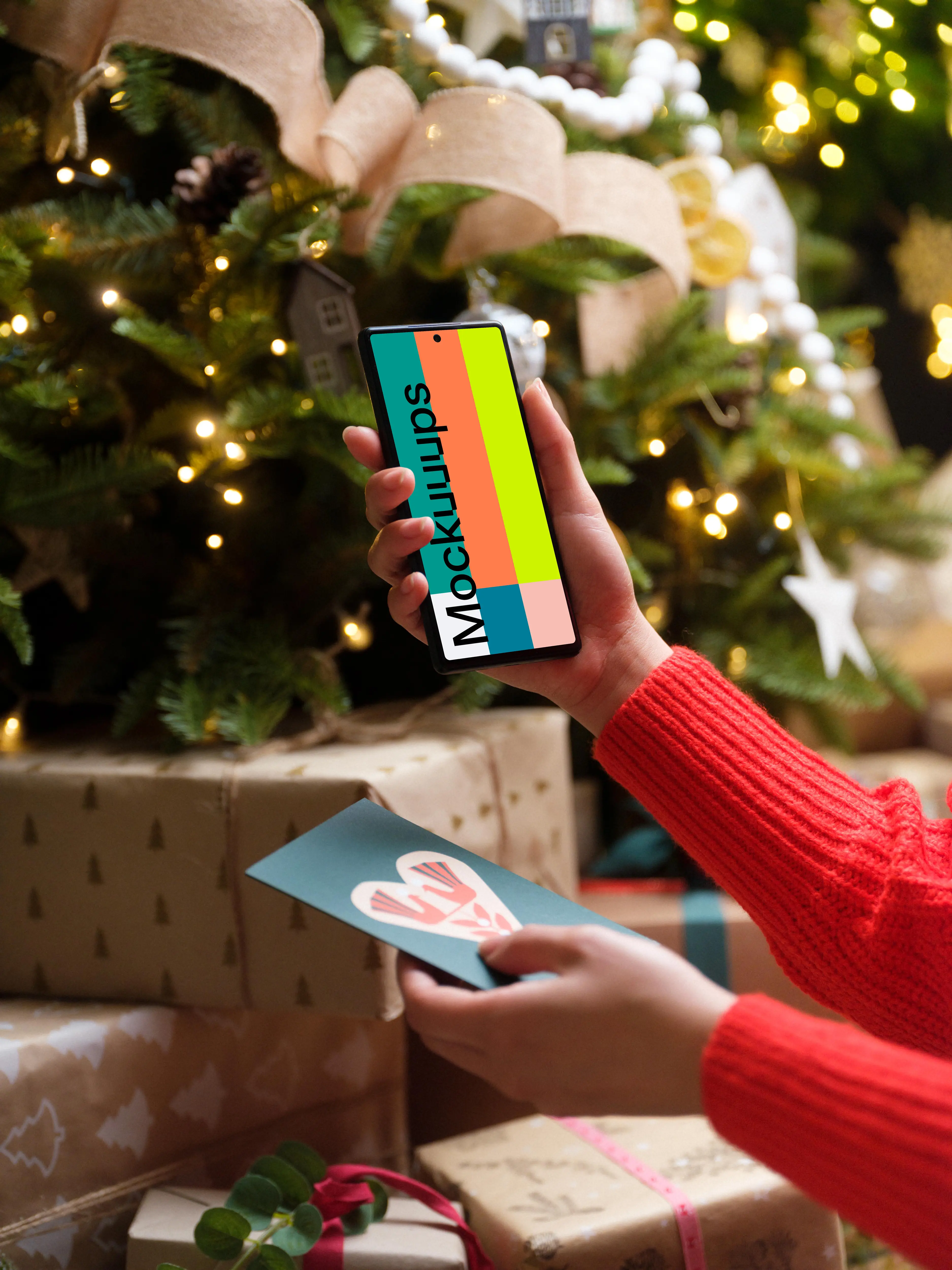 Woman in red sweater holding smartphone and gift card